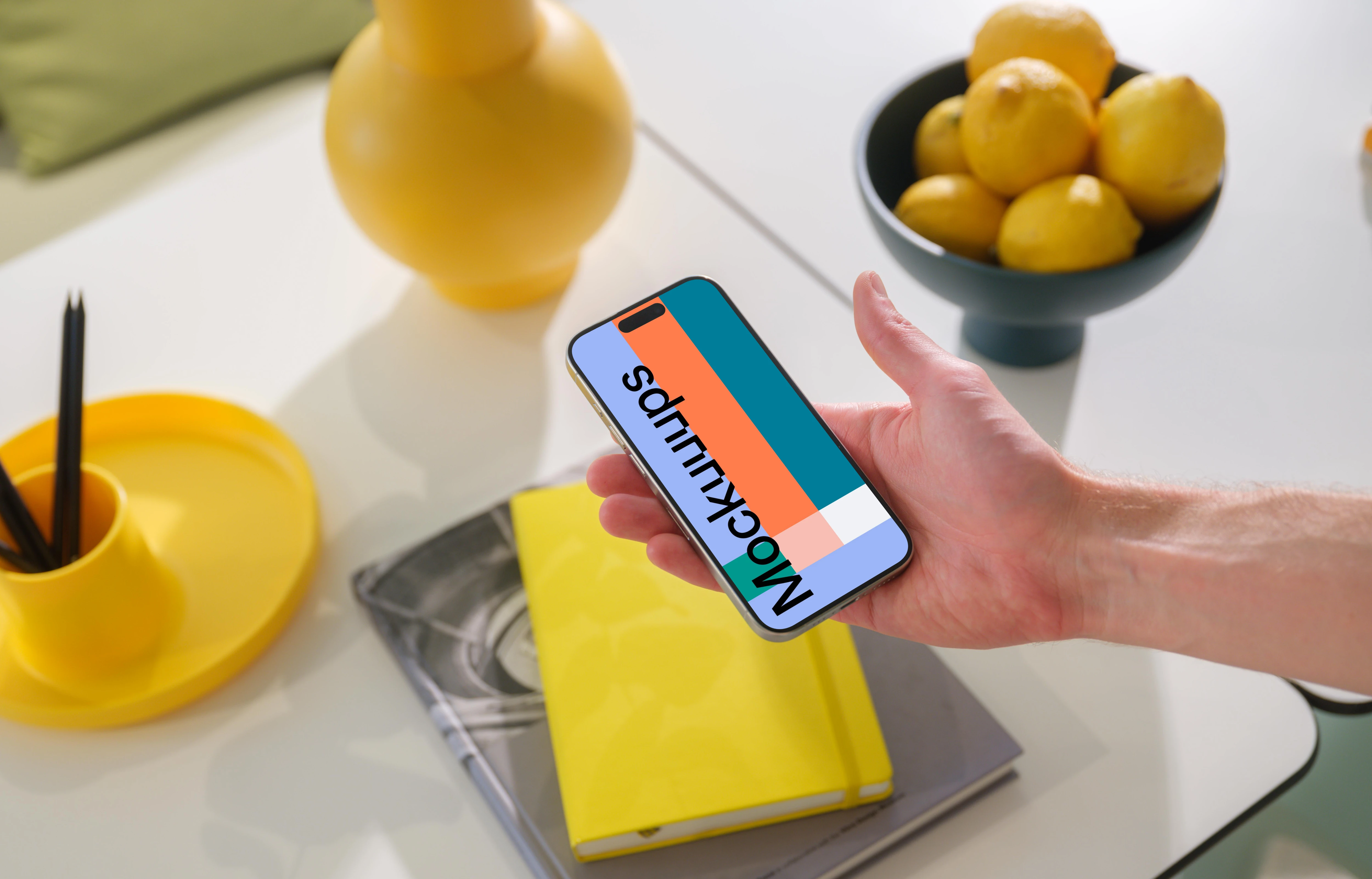 iPhone 15 Pro mockup in a vibrant creative setting