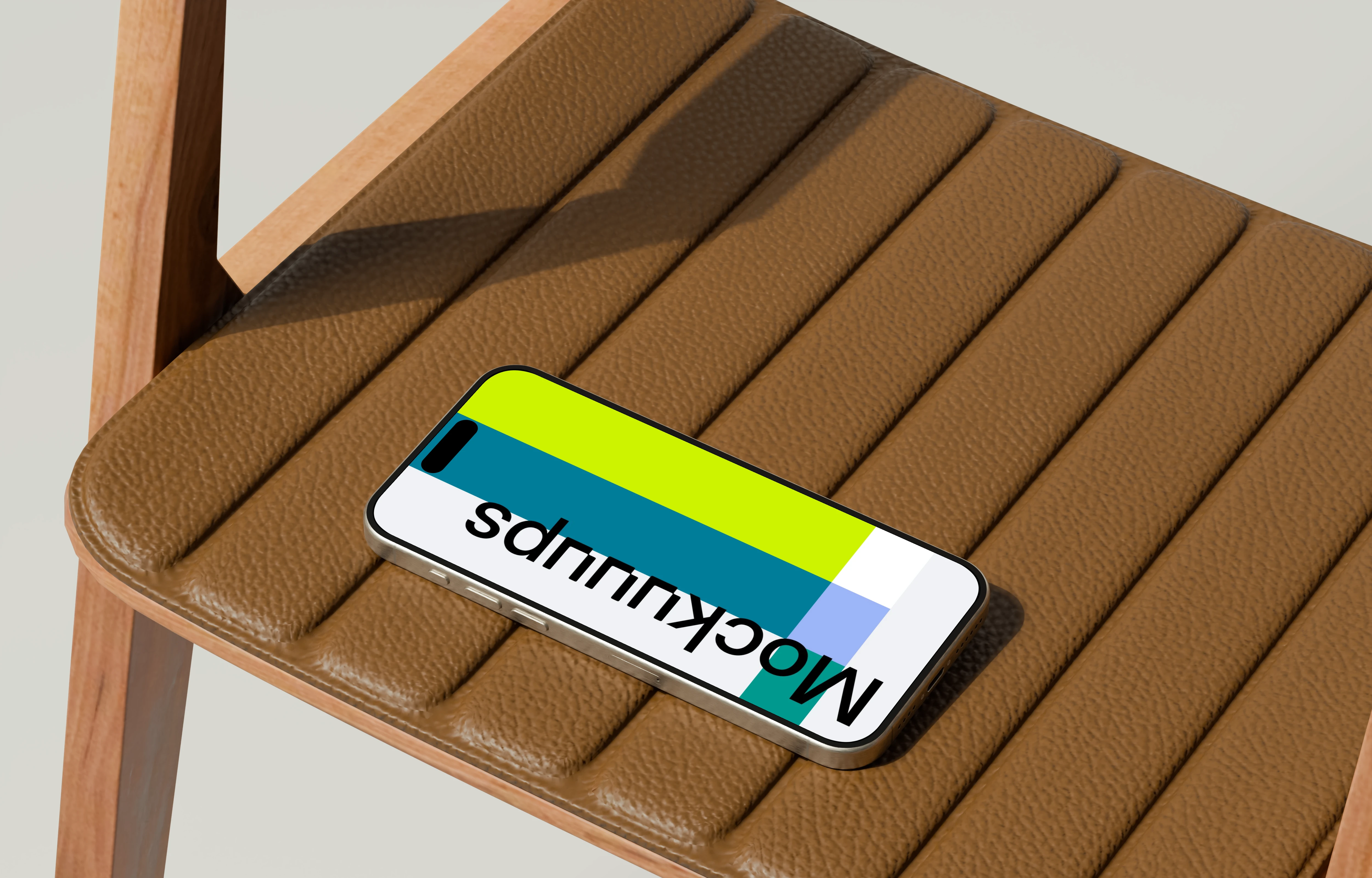 iPhone 16 mockup on a leather chair