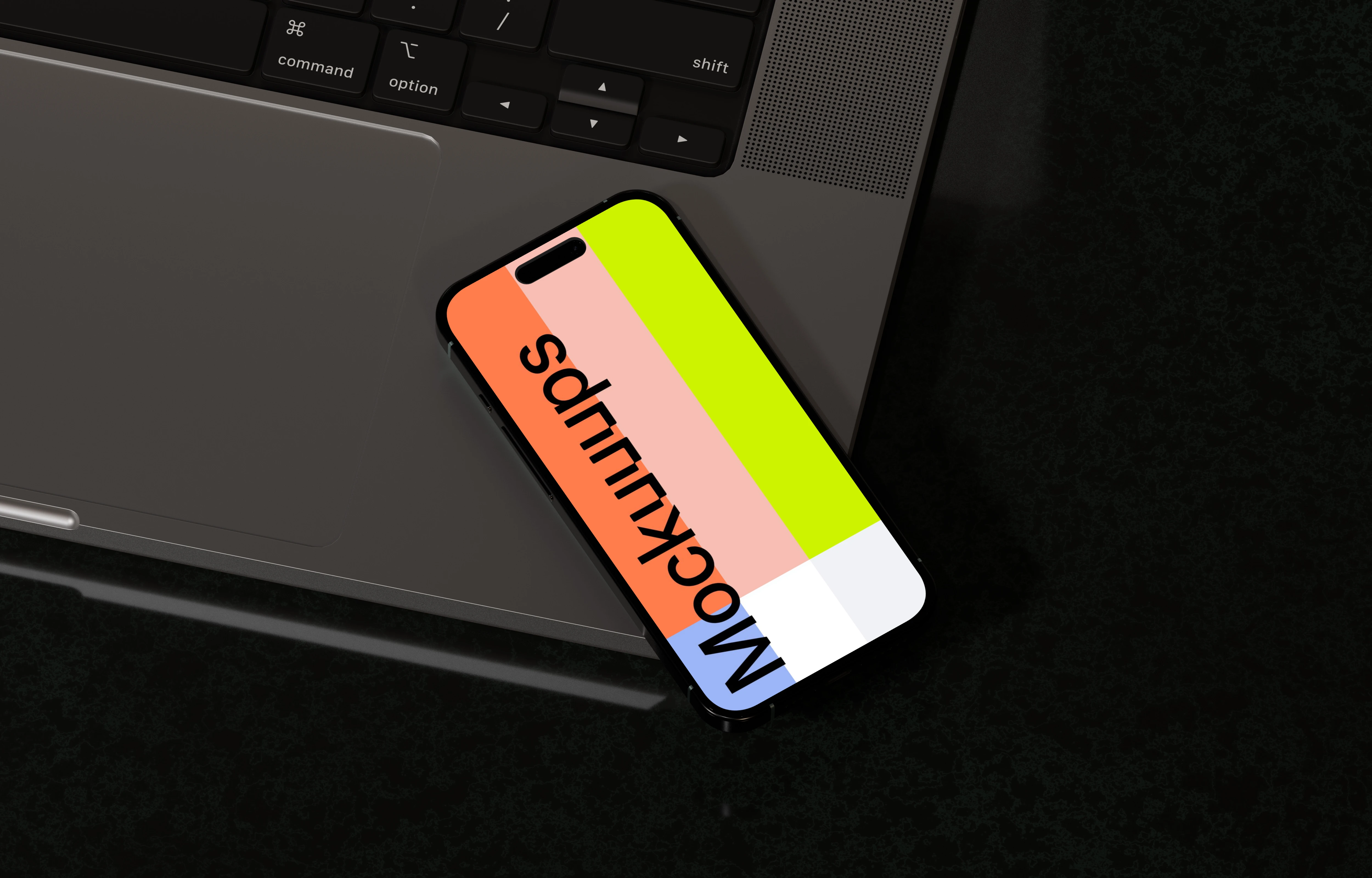 iPhone 16 mockup with laptop on black surface