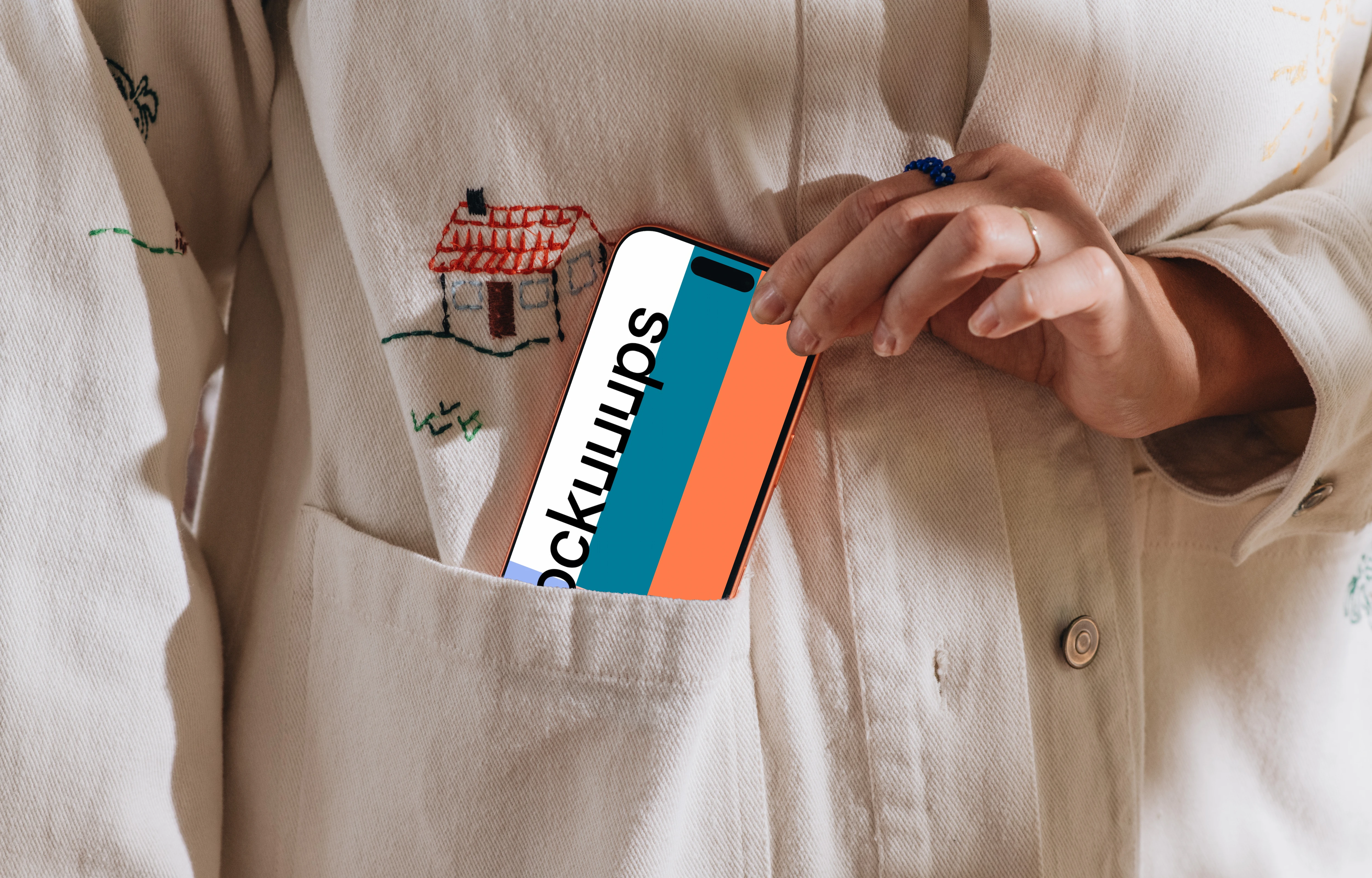 iPhone 17 Pro mockup in a pocket of embroidered clothing