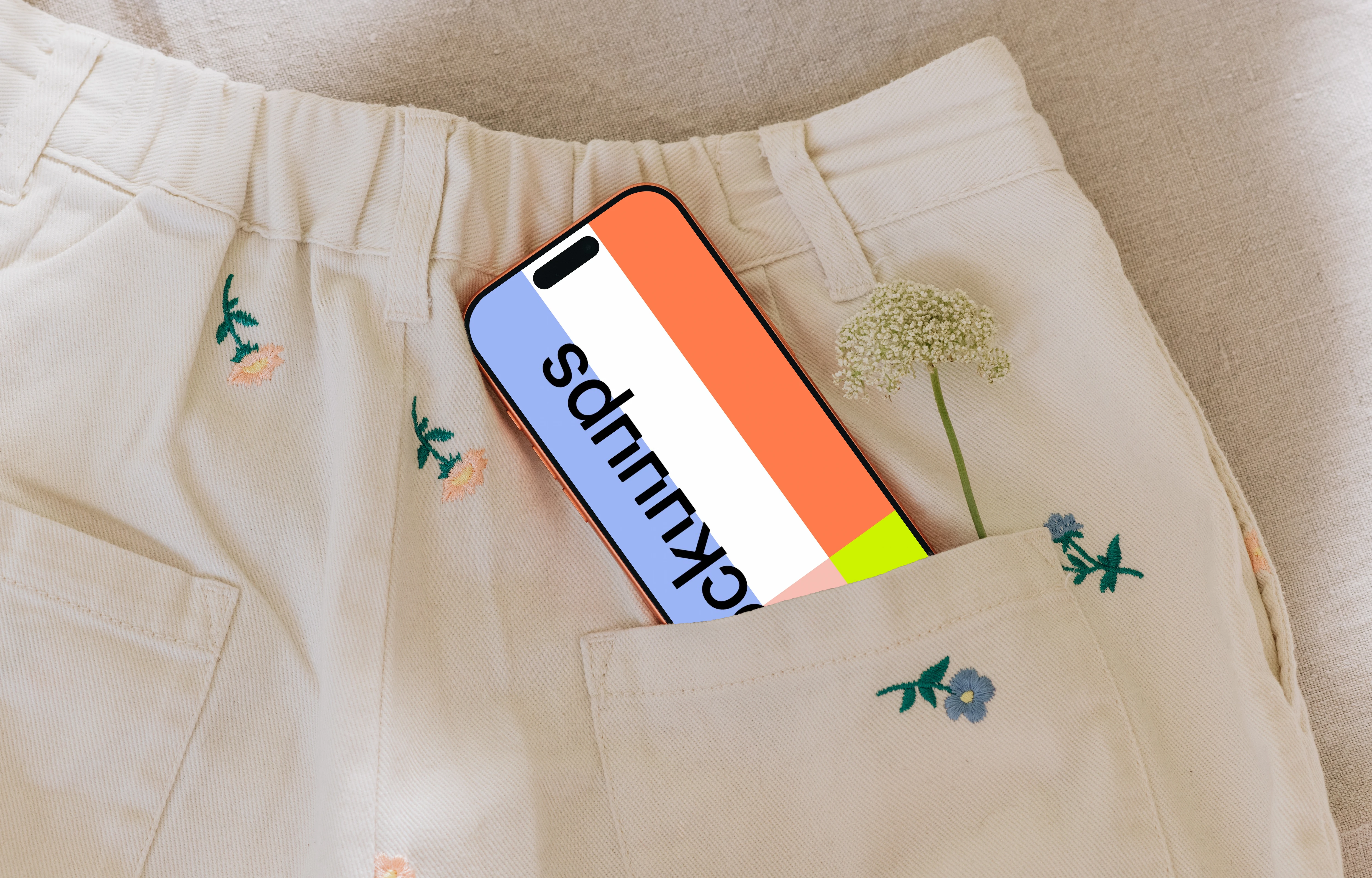 iPhone 17 Pro mockup in embroidered pocket