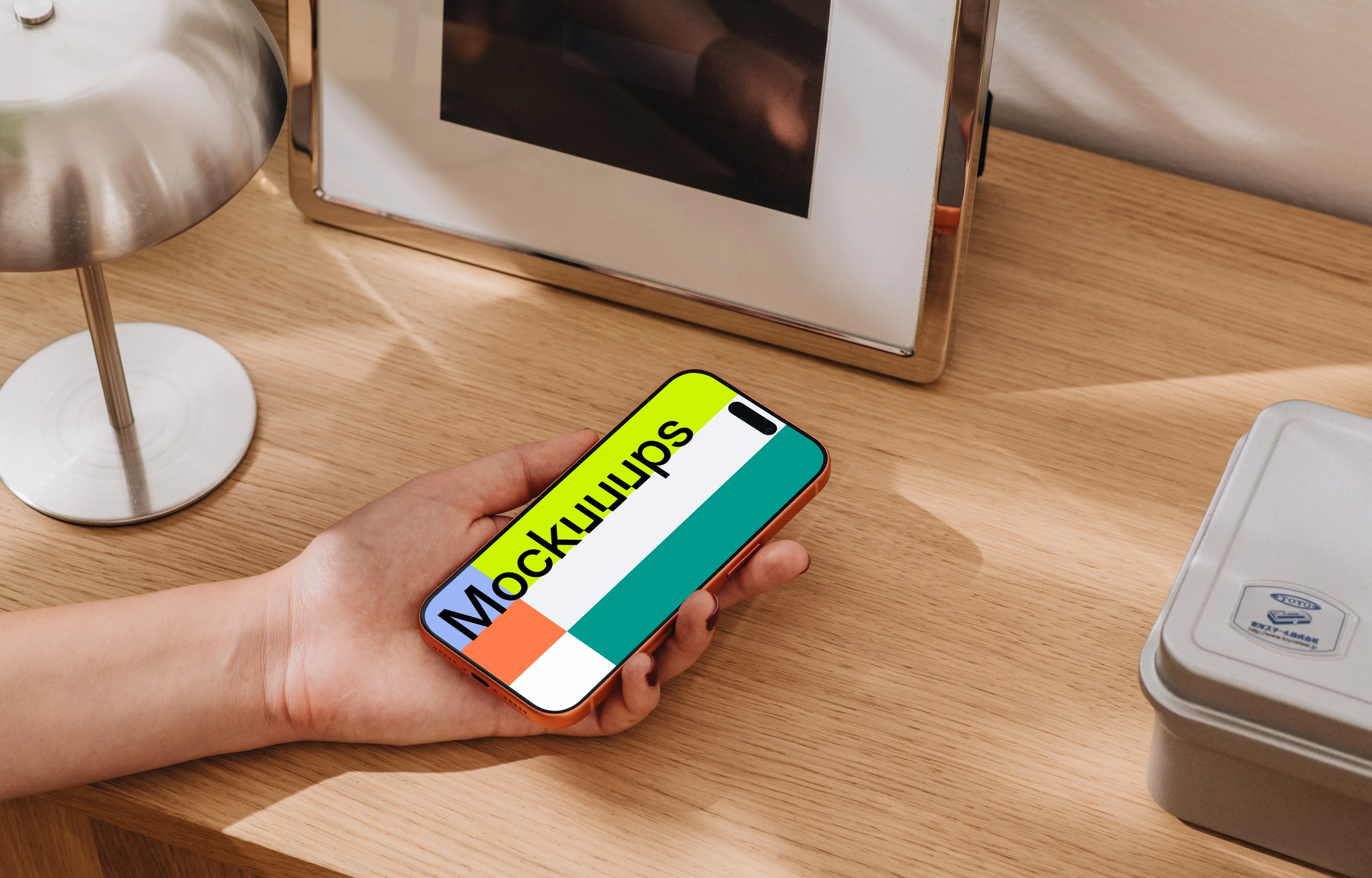 iPhone 17 Pro mockup on a wooden desk