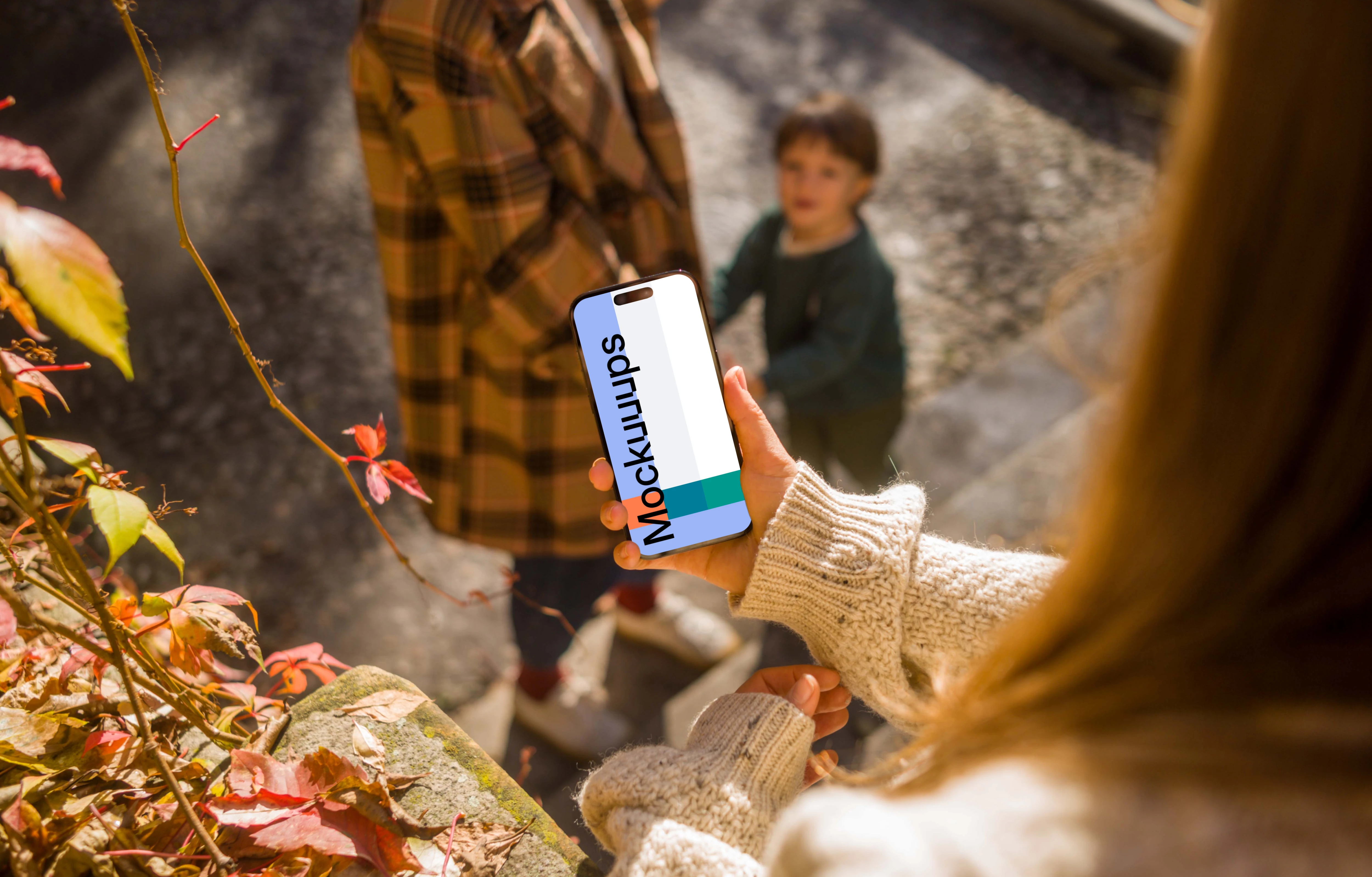Woman hand holding an iPhone 14 Pro mockup