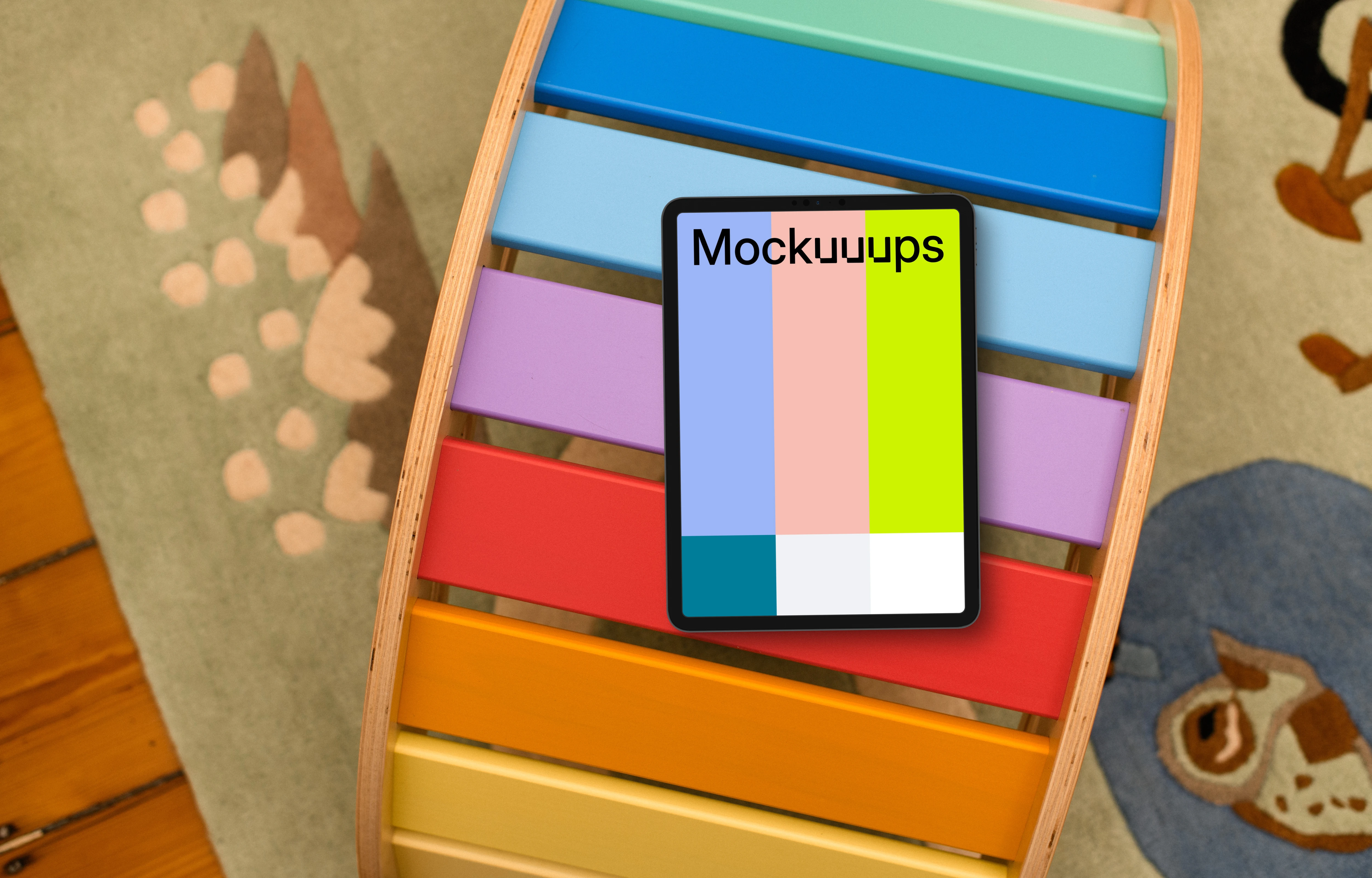 Tablet mockup on colorful children's bookshelf