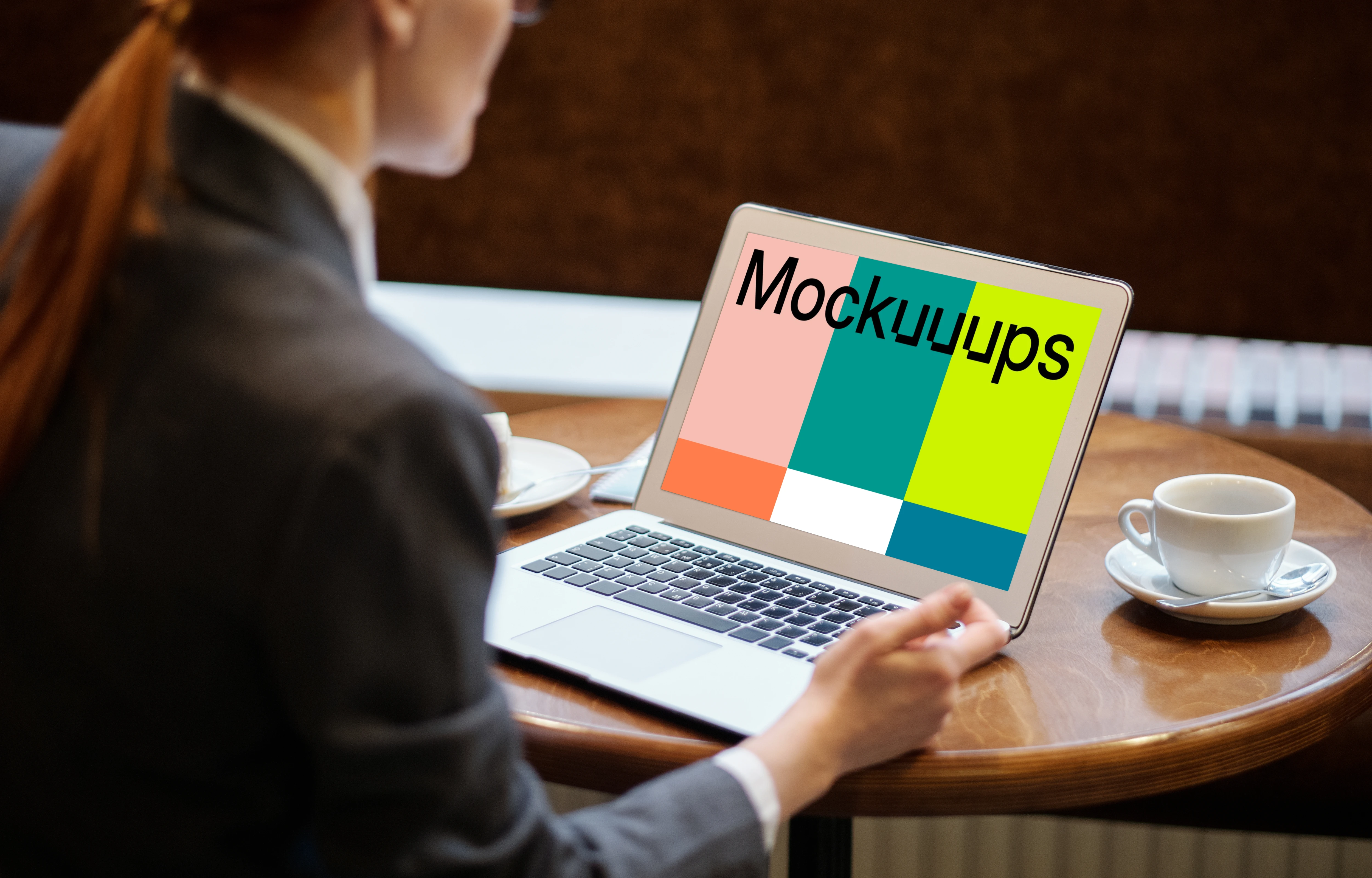 Lady using a MacBook Air mockup with a cup of coffee at the side