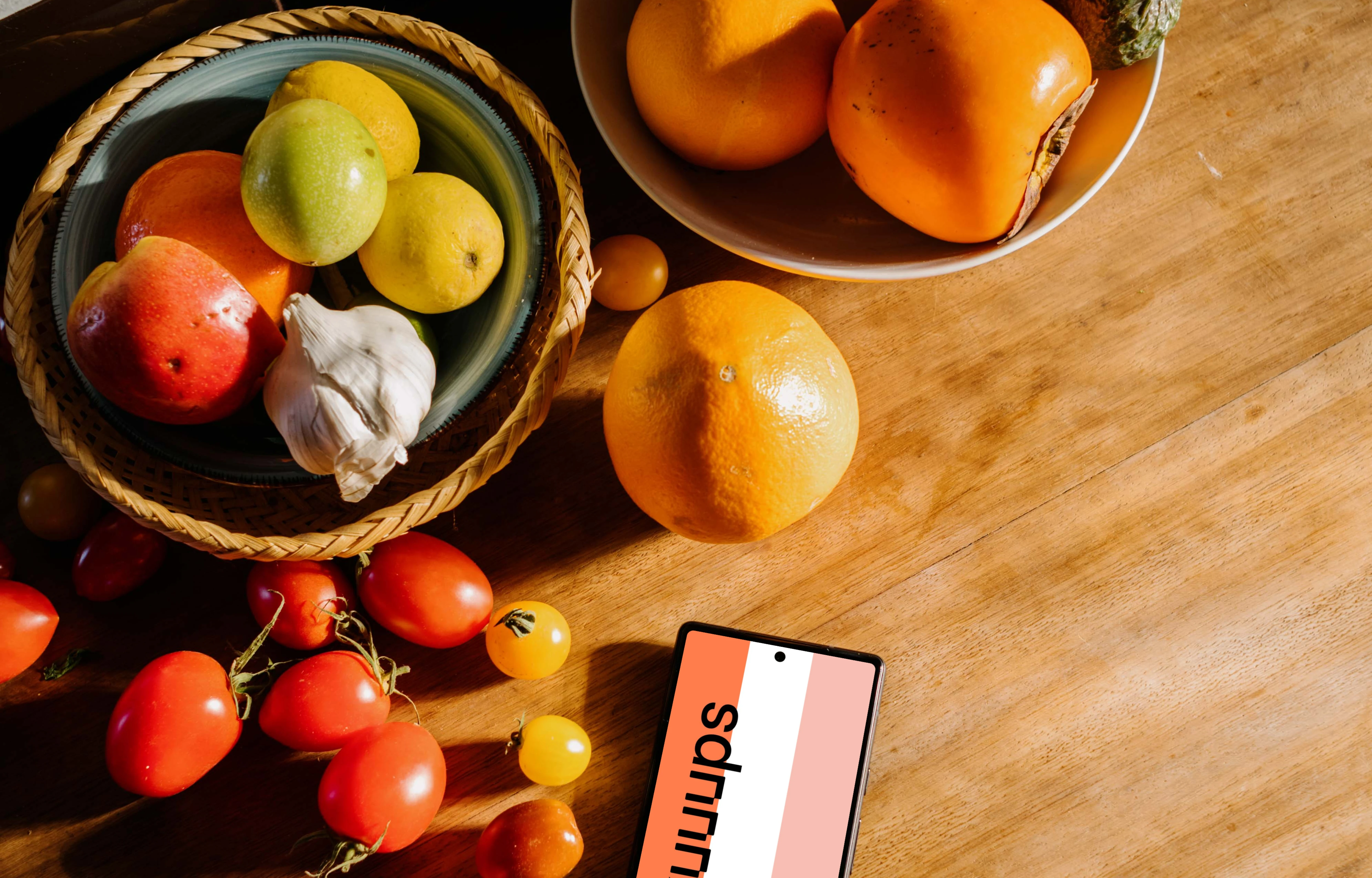 Pixel 6 mockup on a table next to fruits