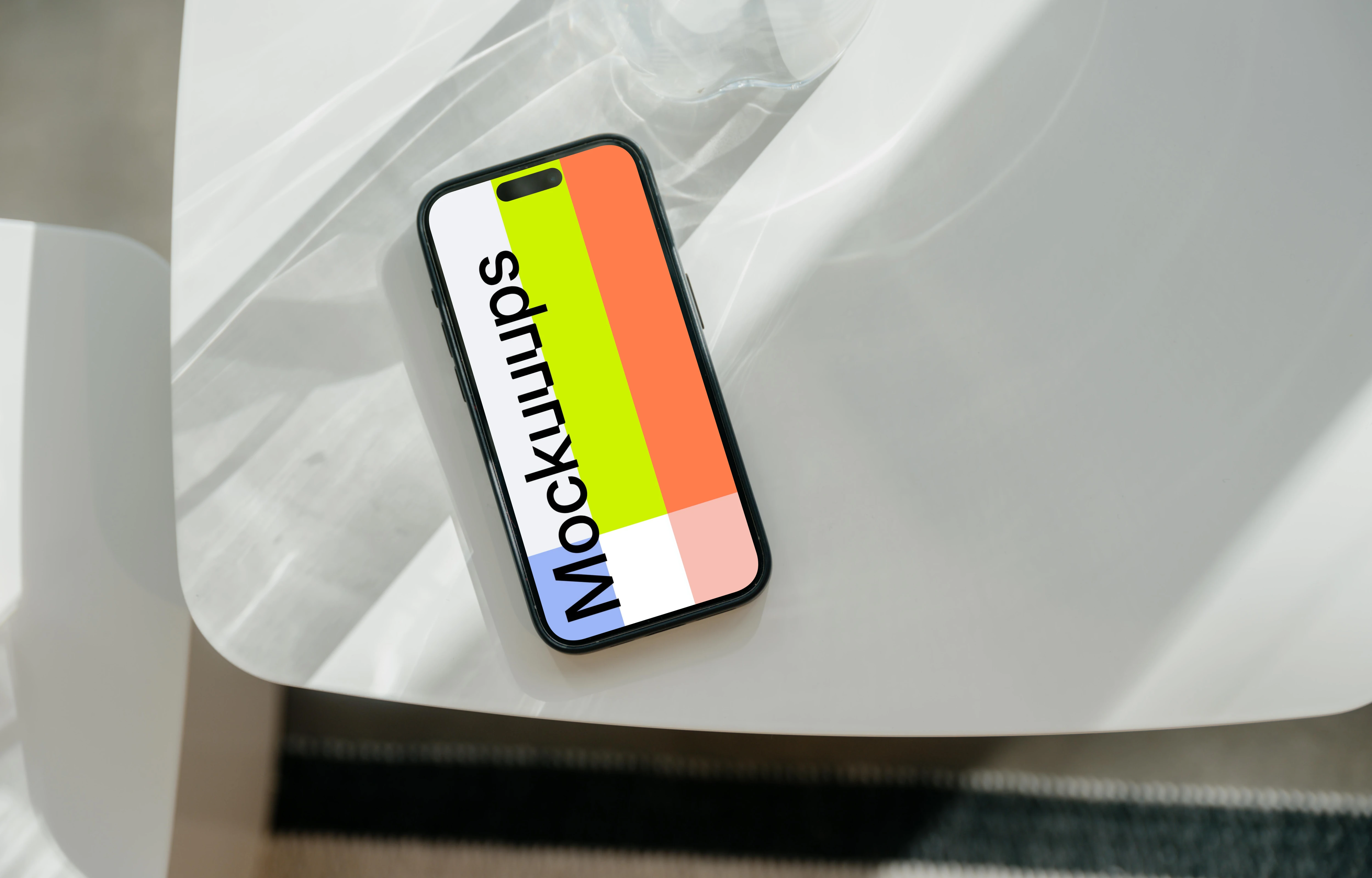 iPhone 15 Pro mockup on a white modern table