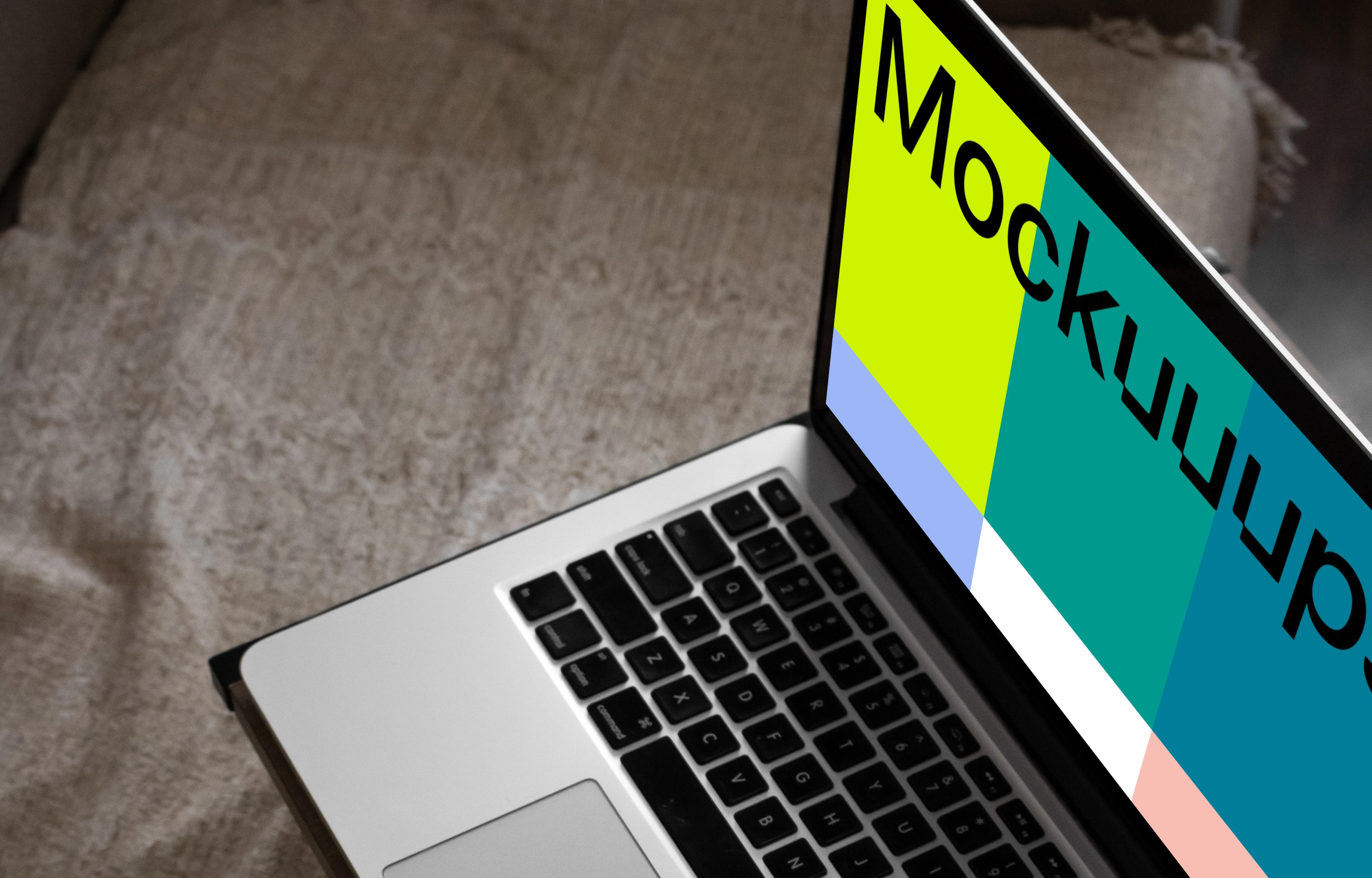 MacBook mockup on bed