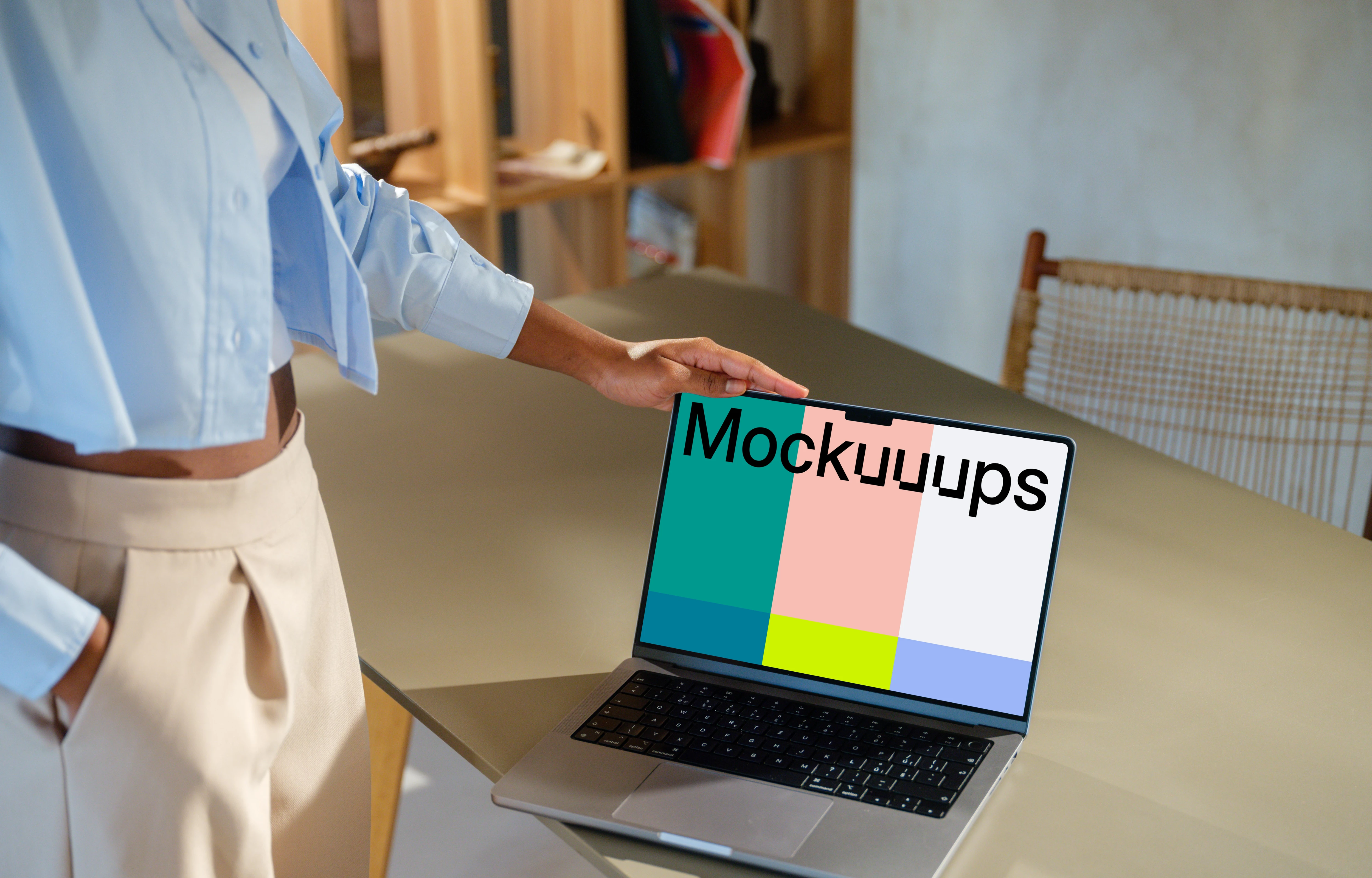 MacBook Pro 14 inch mockup with female hand on a modern desk