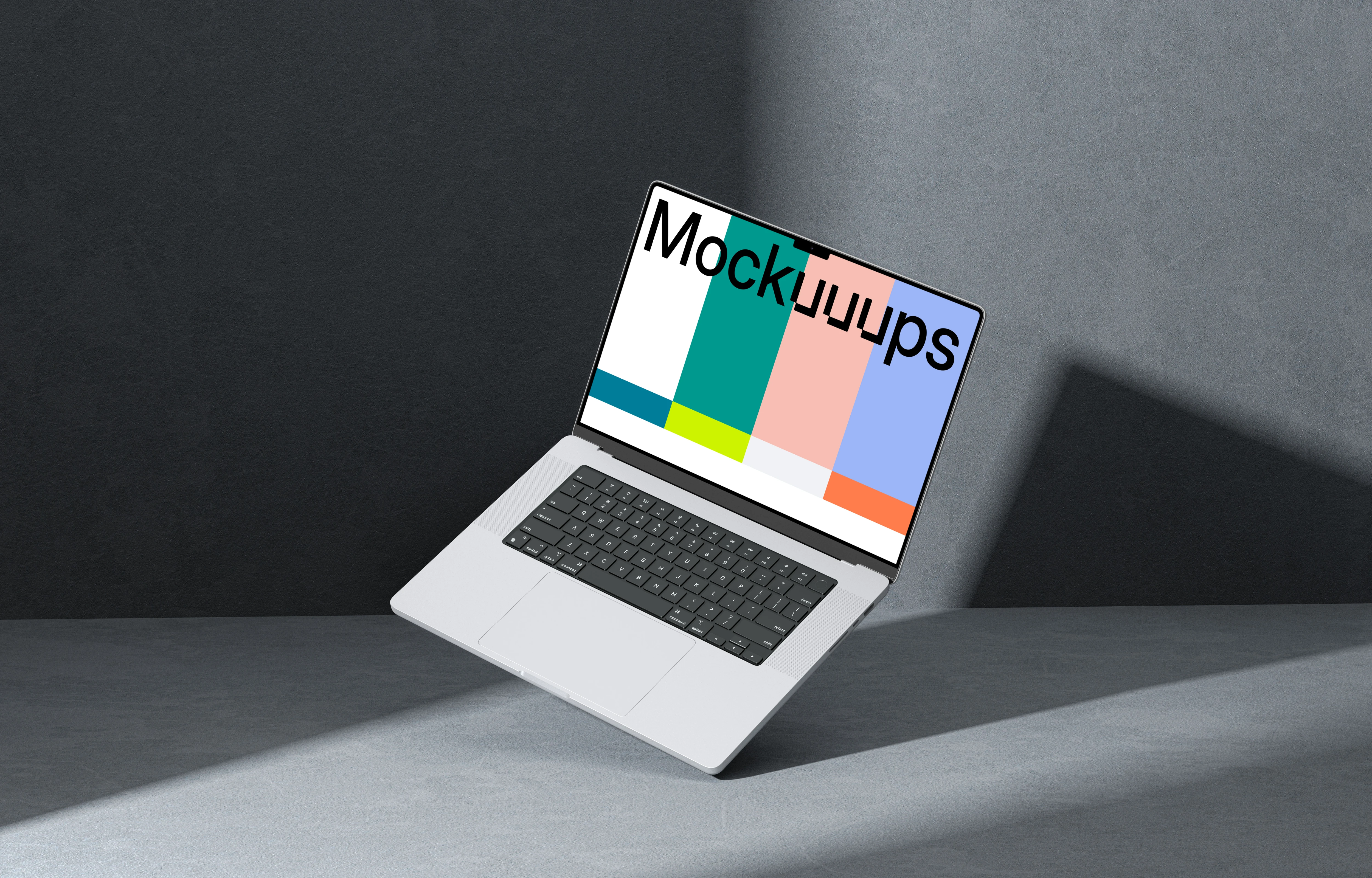MacBook Pro 16 inch mockup on a textured gray surface with dramatic lighting