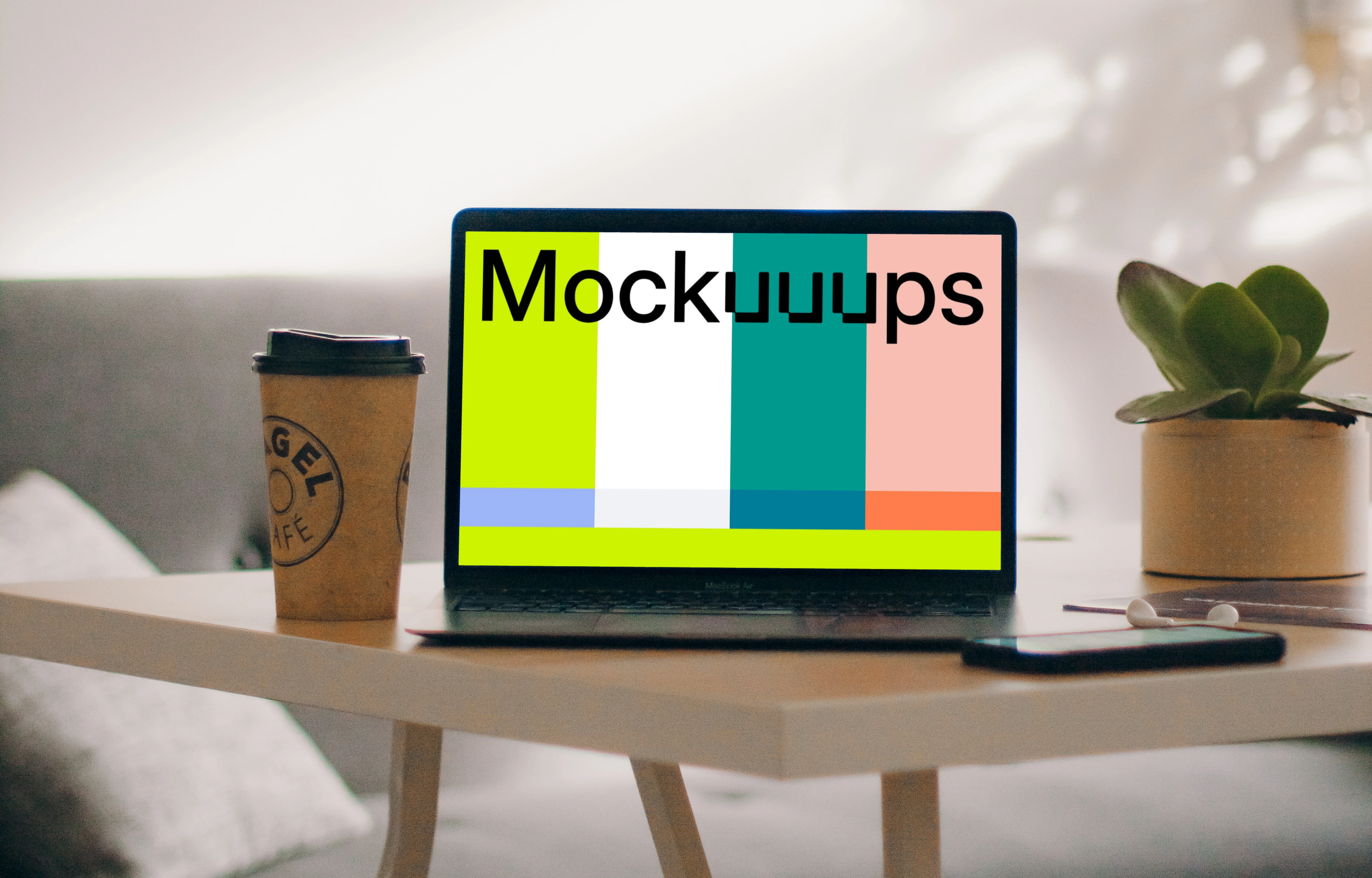 MacBook Pro mockup beside a cup of coffee