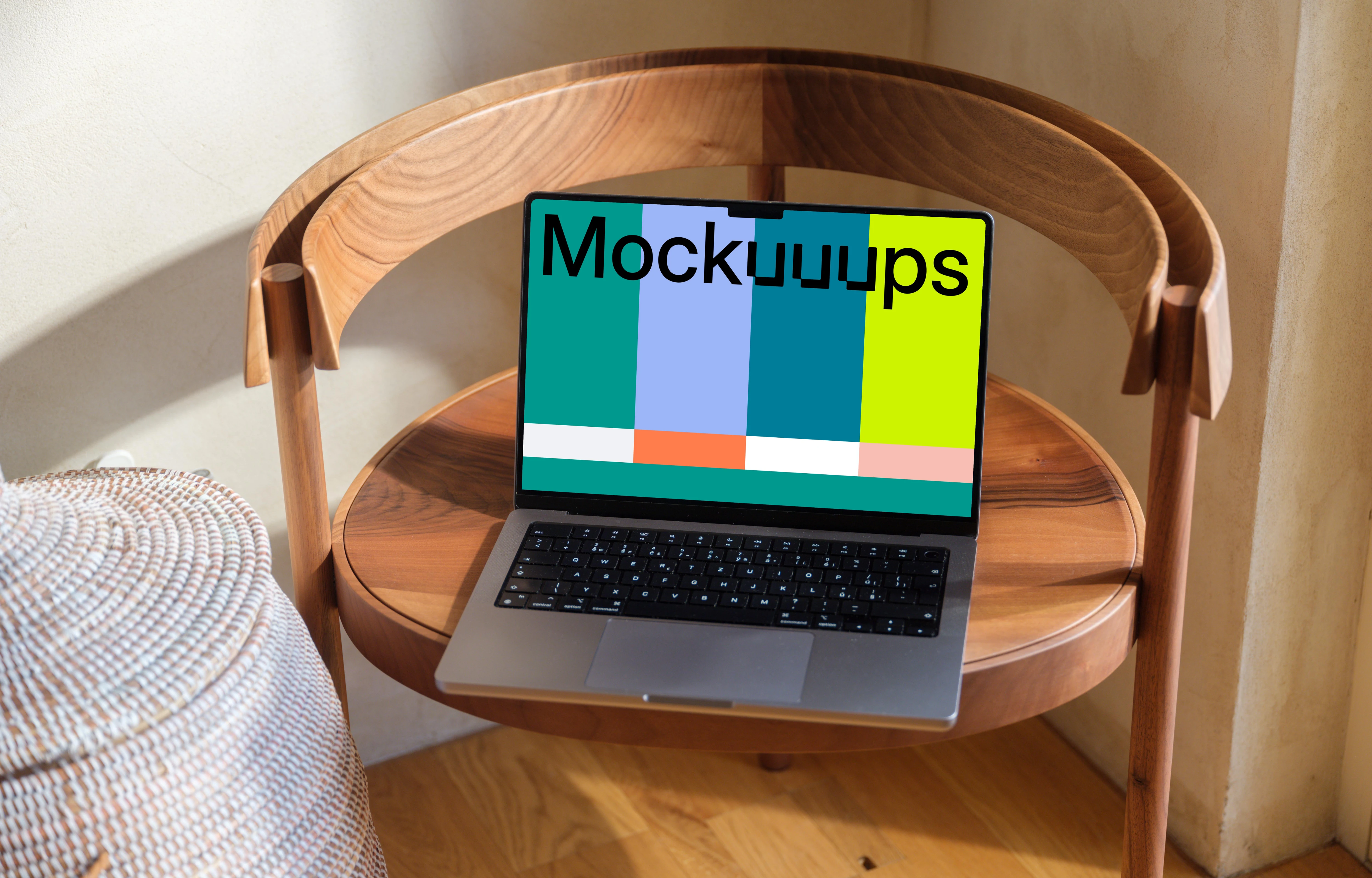 MacBook Pro mockup on a round wooden table