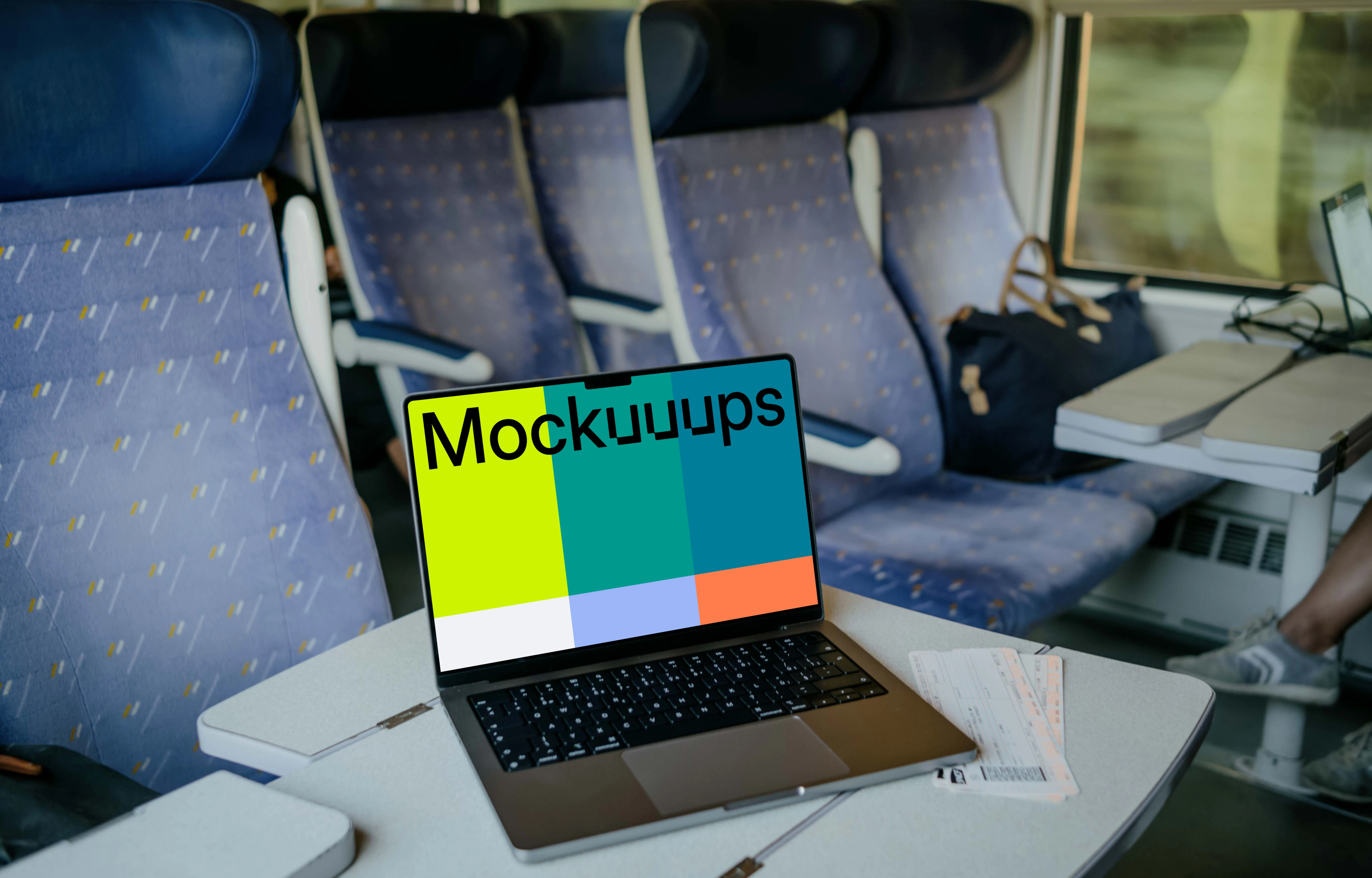 MacBook Pro mockup on train table