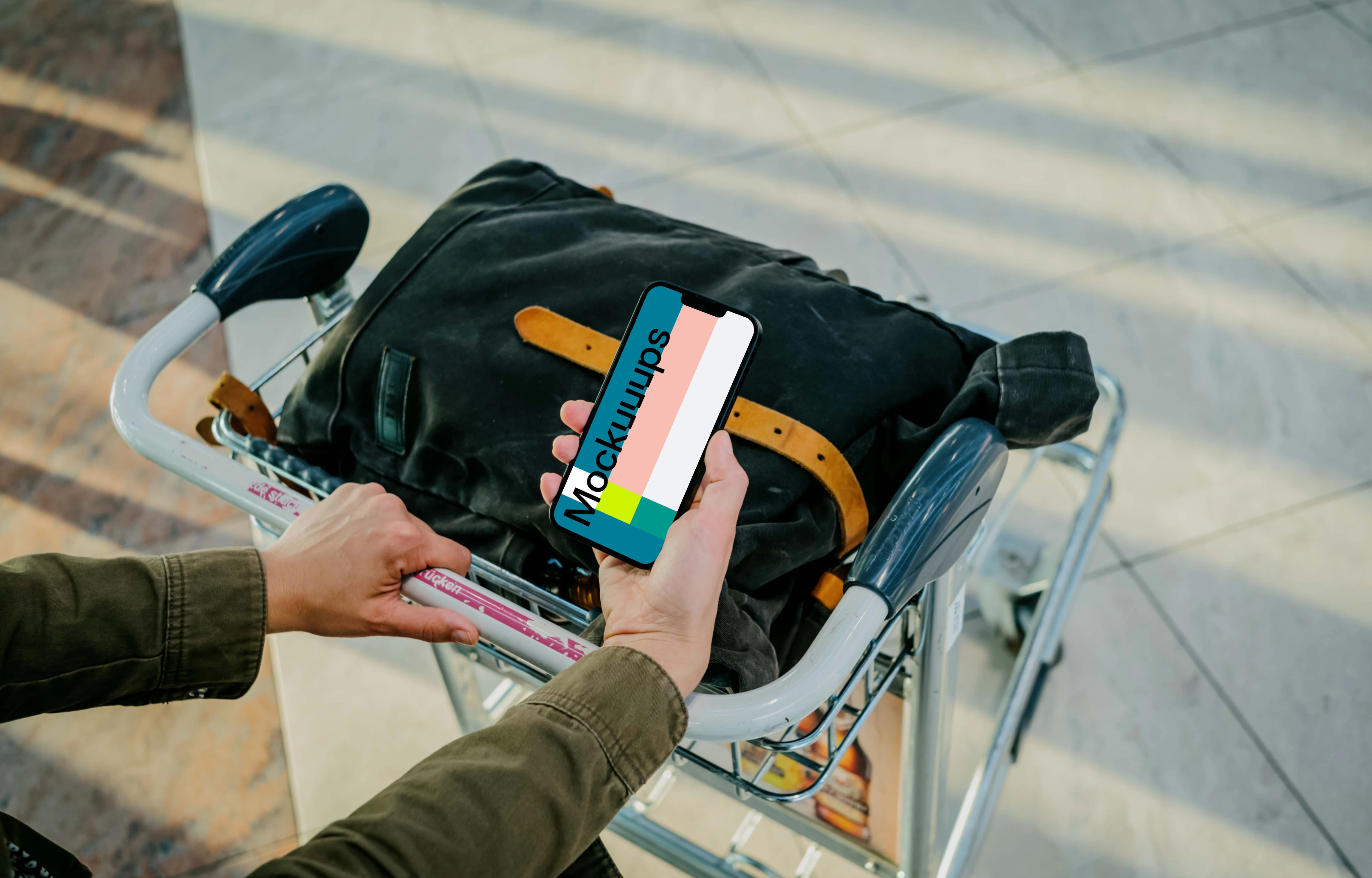Man hand holding an iPhone 13 mockup