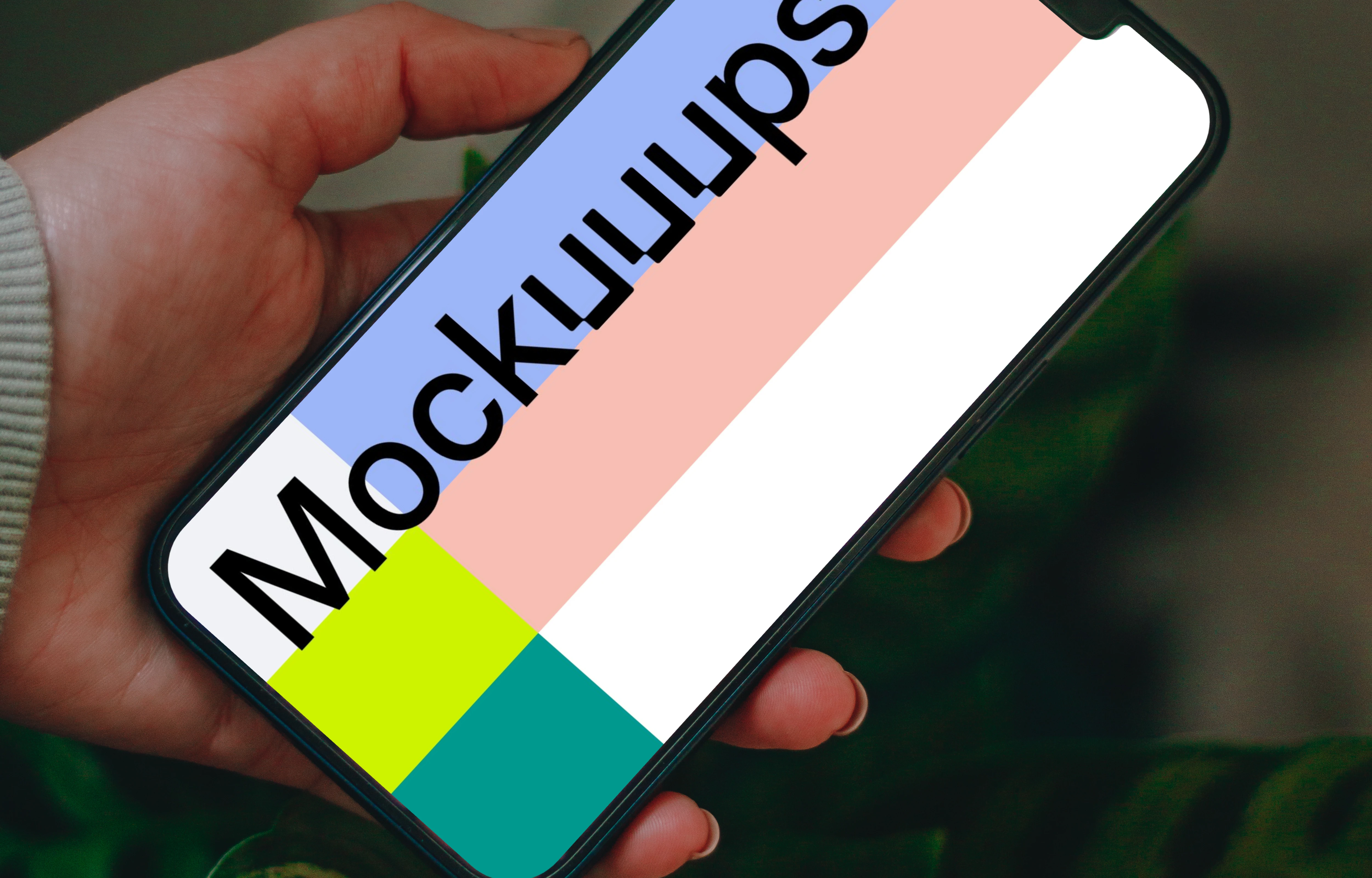 Man holding an iPhone 13 mockup