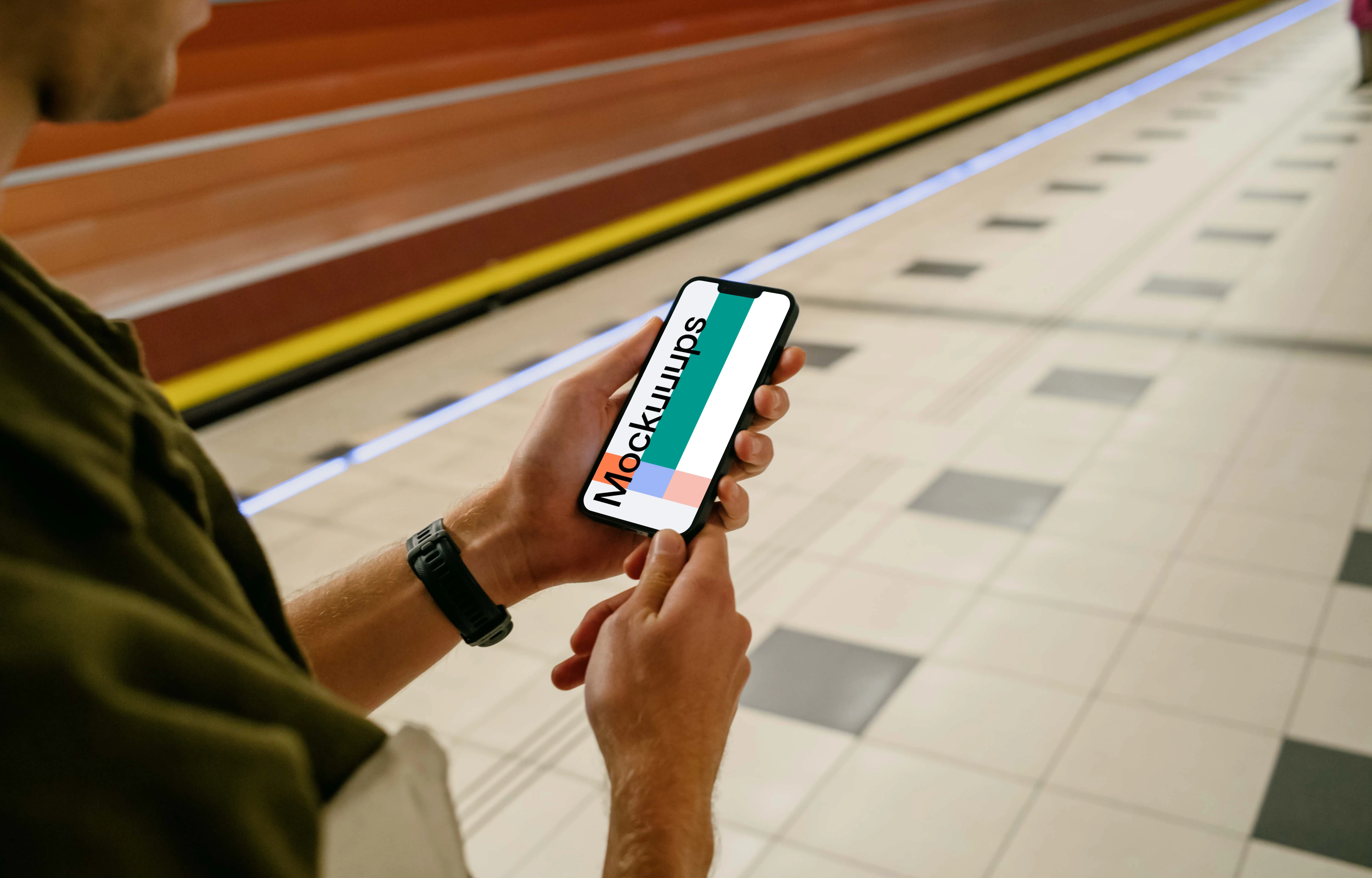 Man holding phone mockup at the subway station