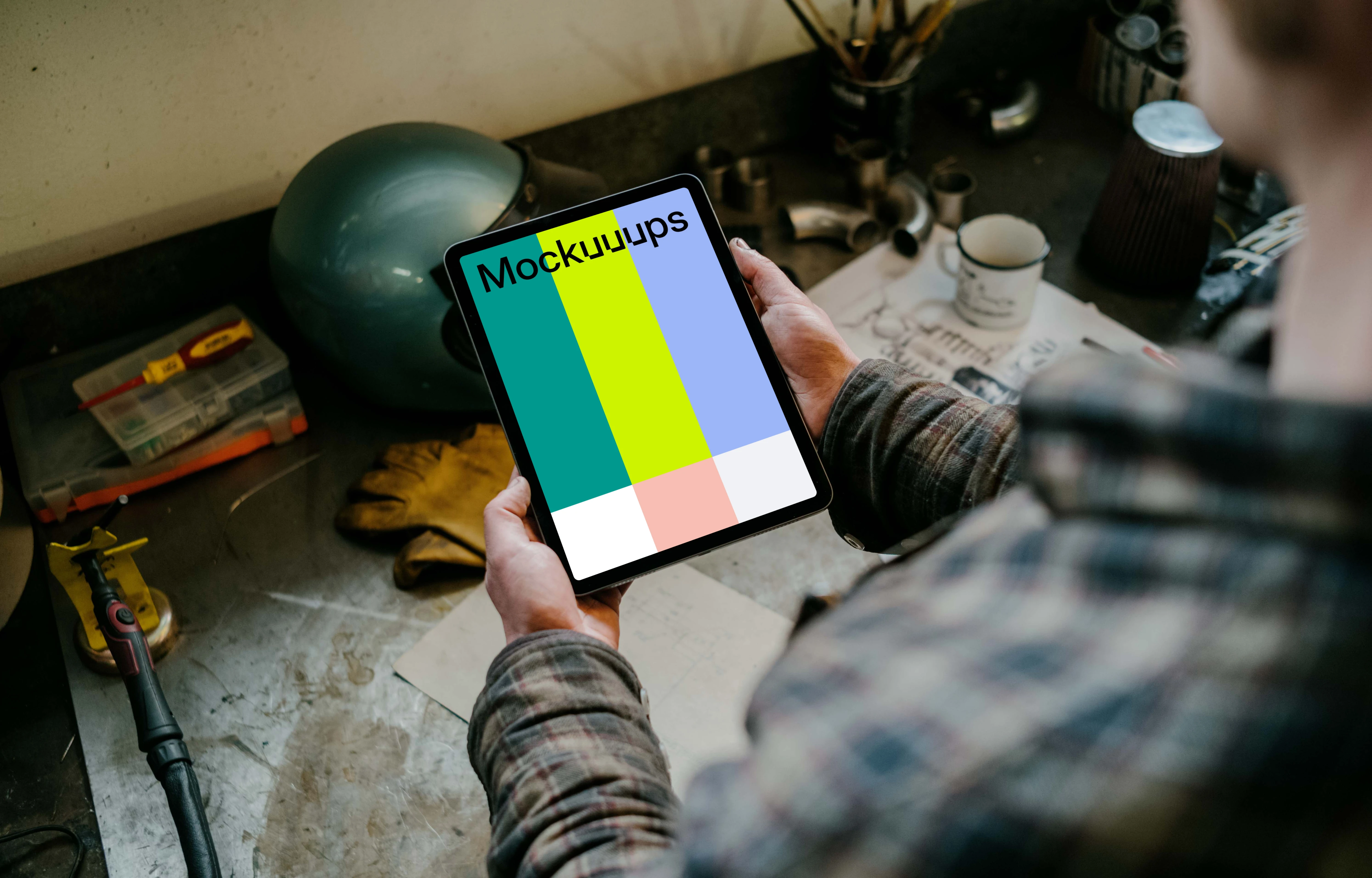 Man holding up an iPad Air mockup