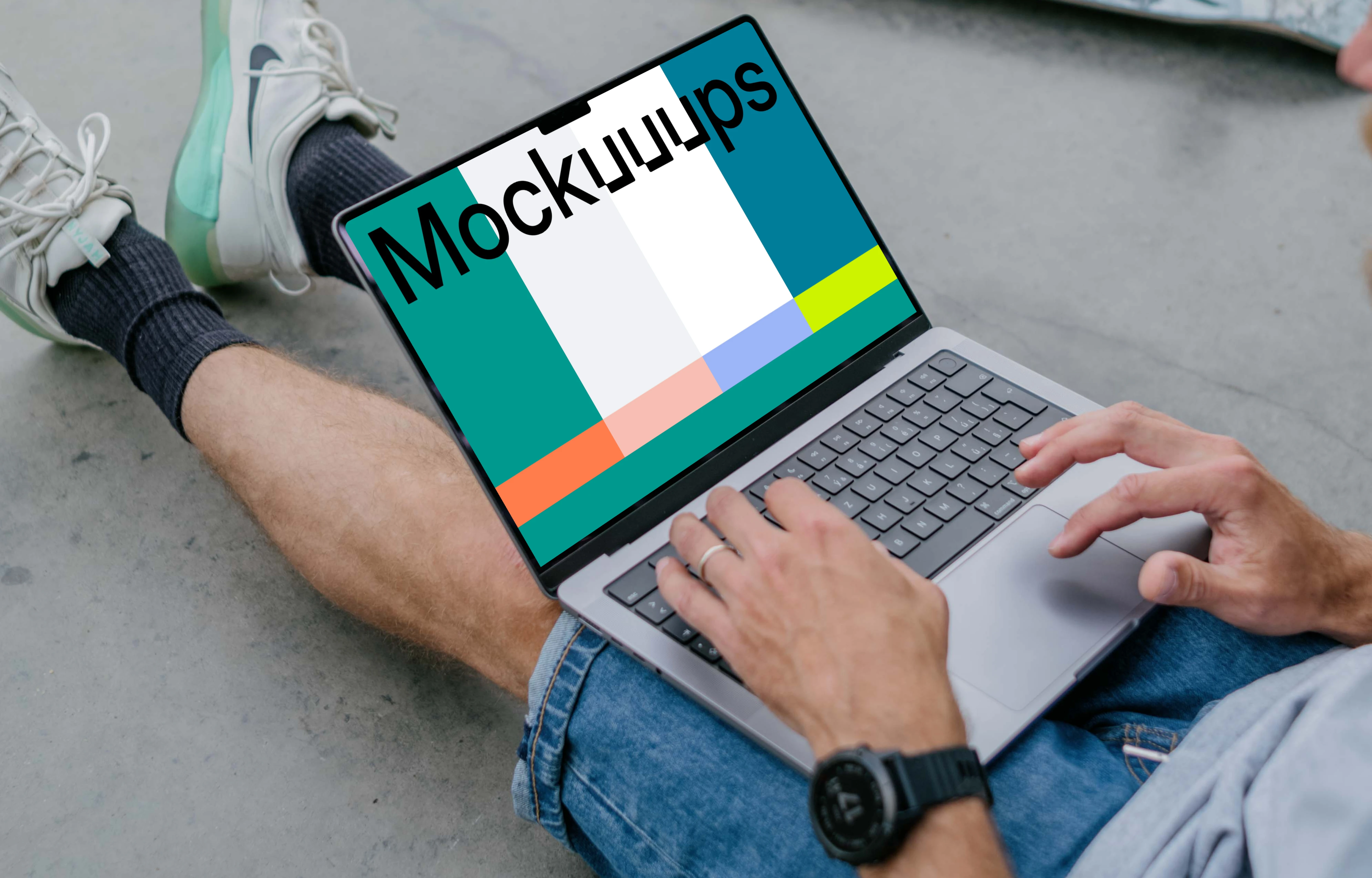 Man typing on a MacBook Pro 14 mockup with skateboard