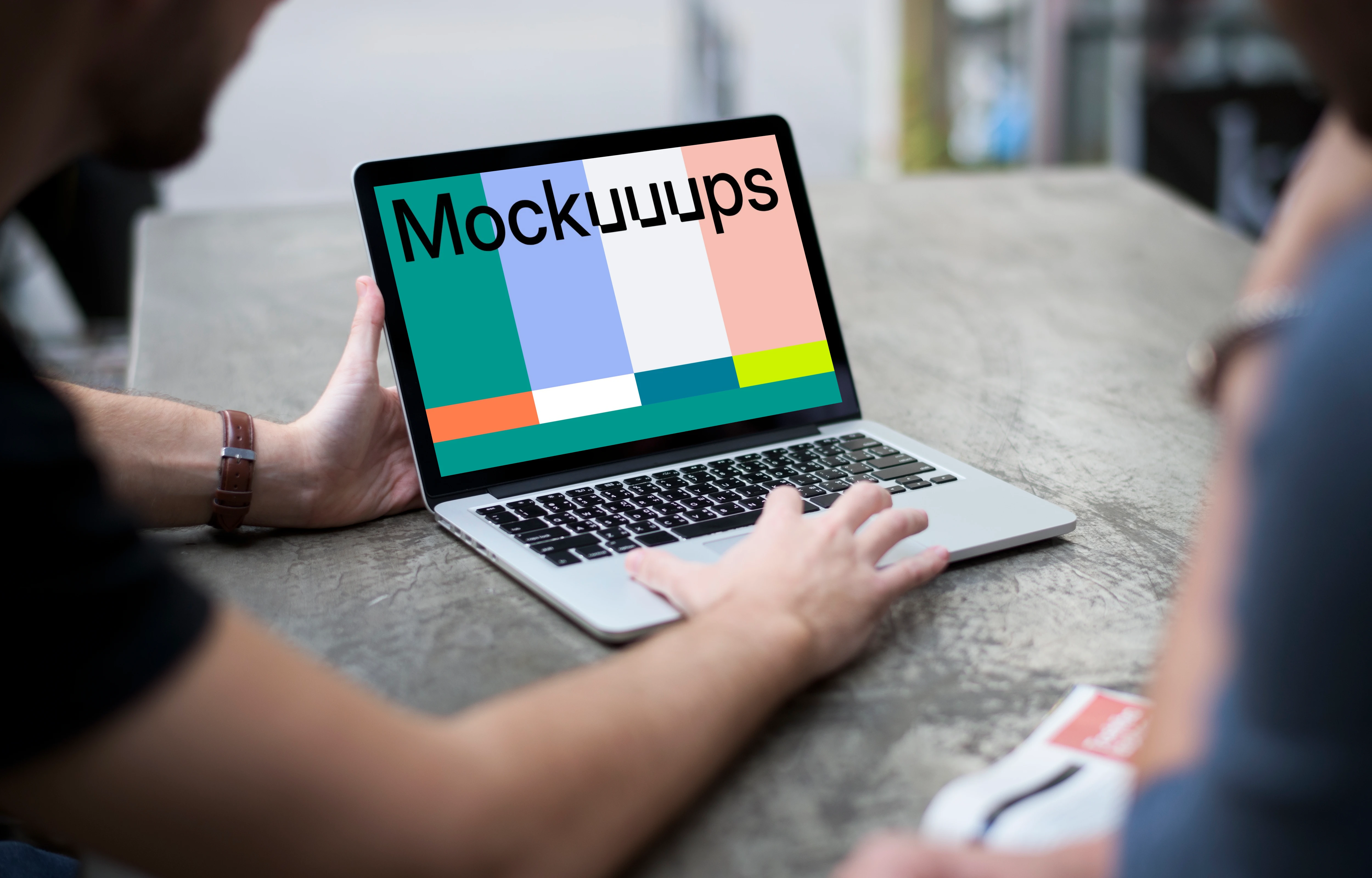 Man working on a MacBook Pro mockup