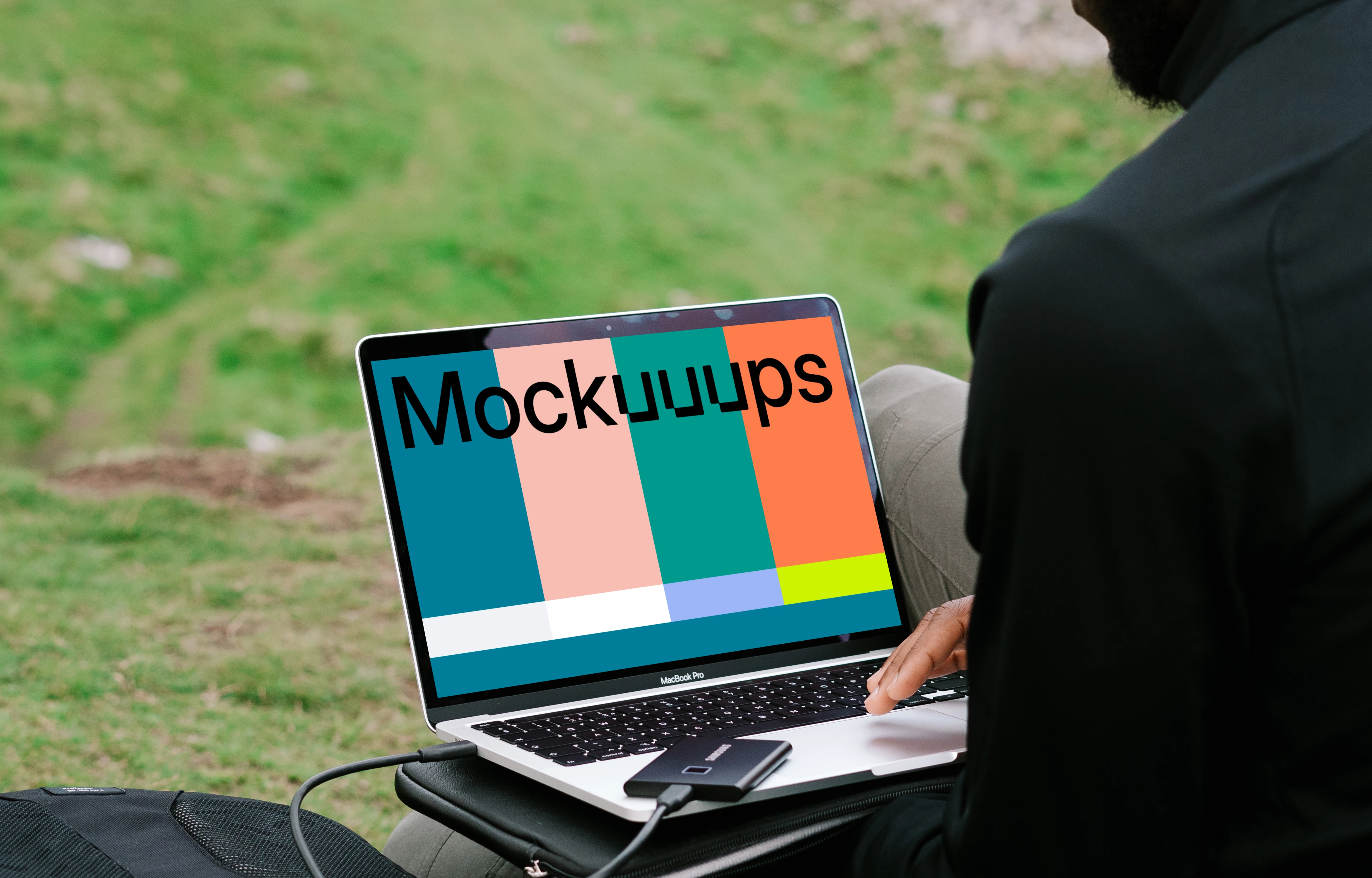 Man working on MacBook Pro mockup