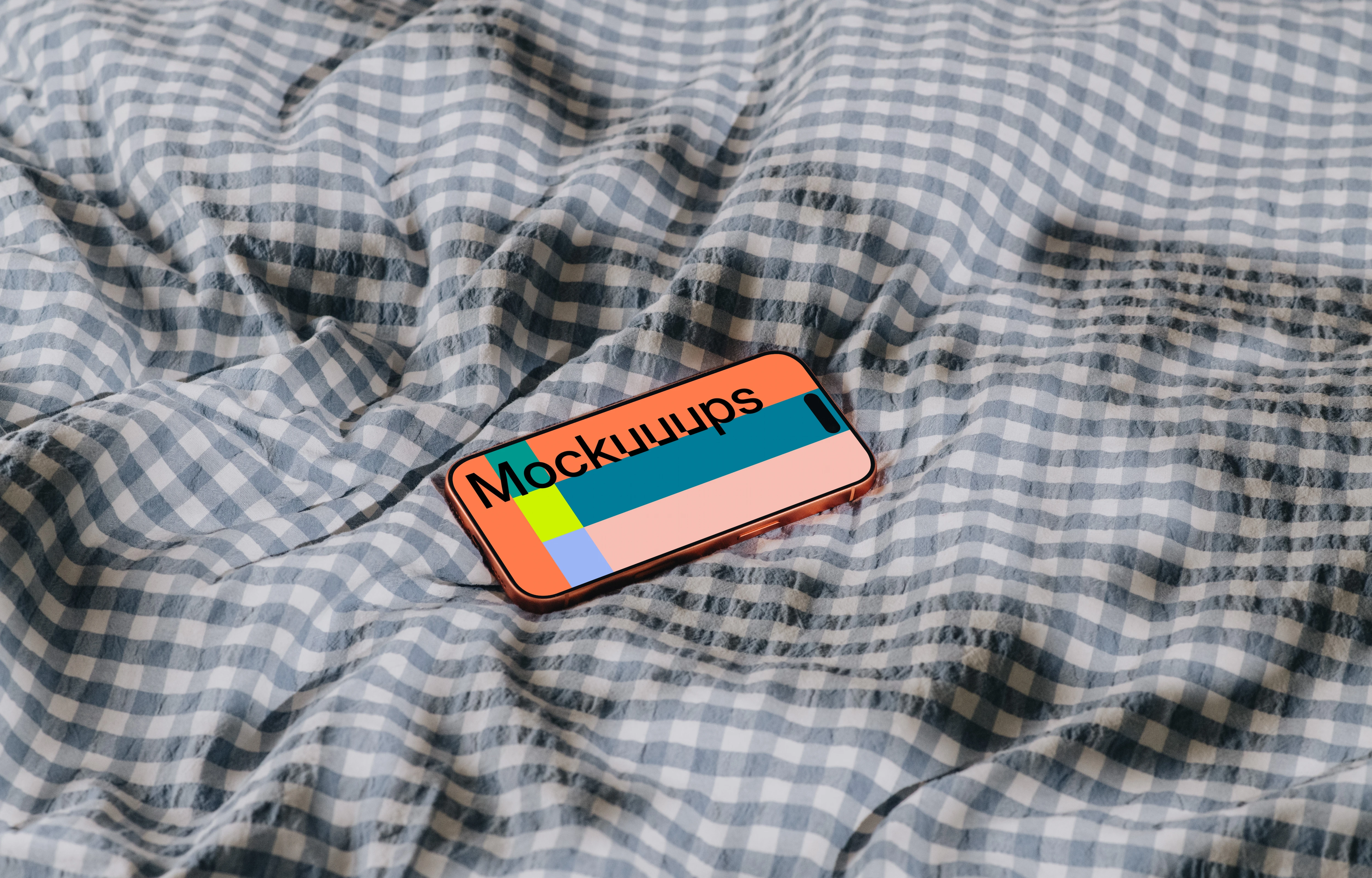 iPhone 17 Pro mockup on a checkered fabric surface