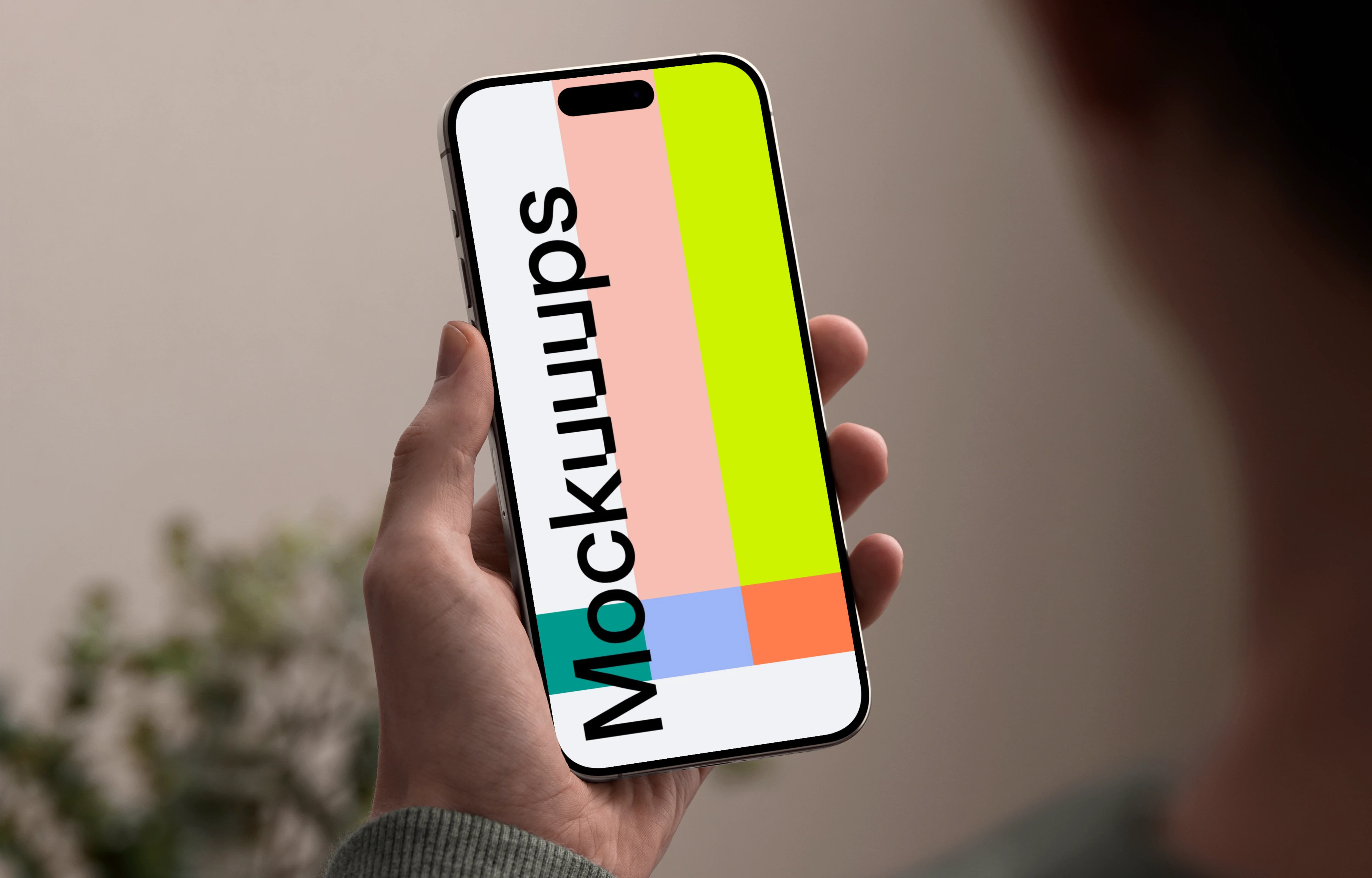 iPhone 15 Pro mockup in male hand against neutral background