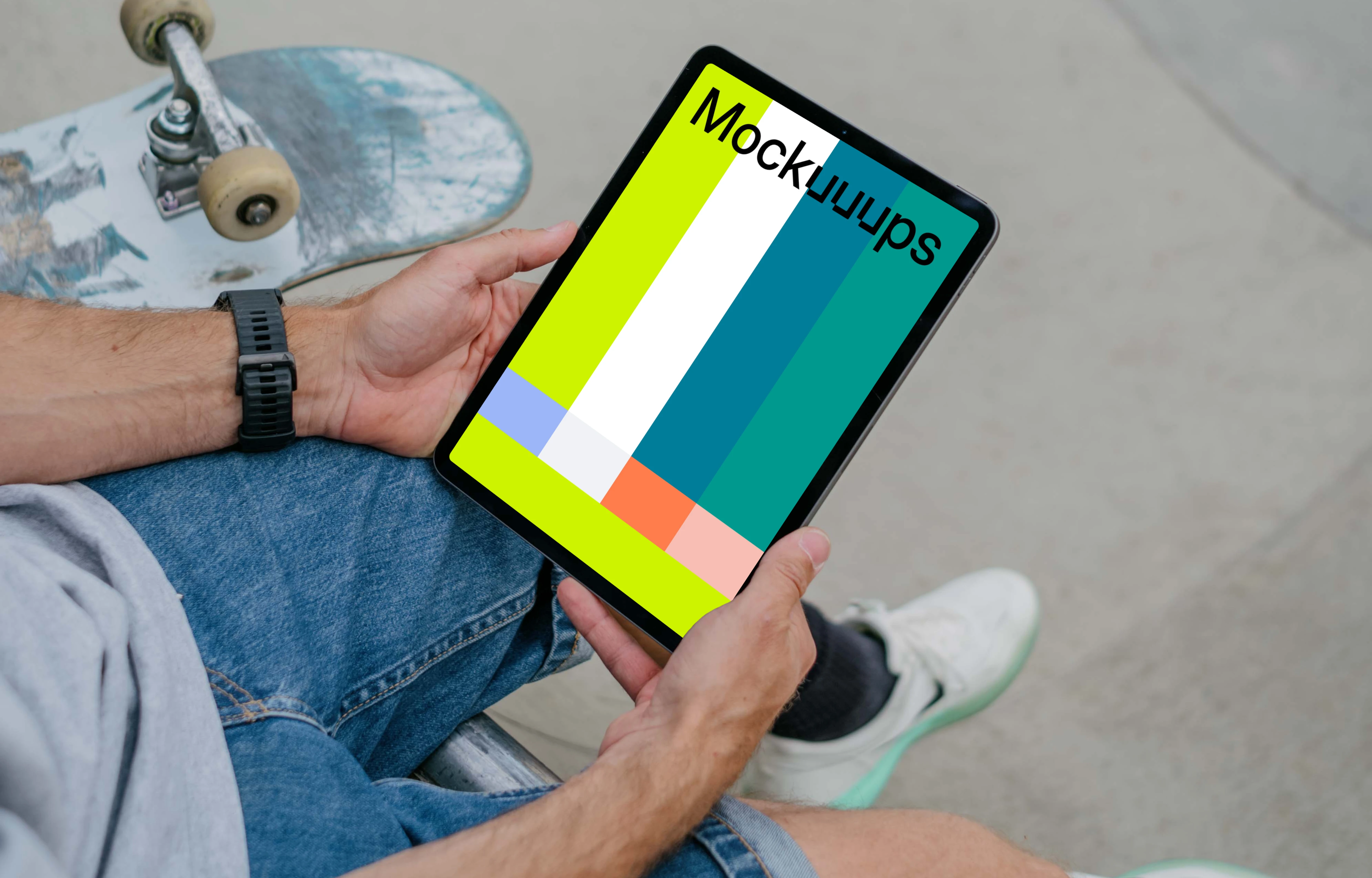Skateboarder holding a tablet mockup