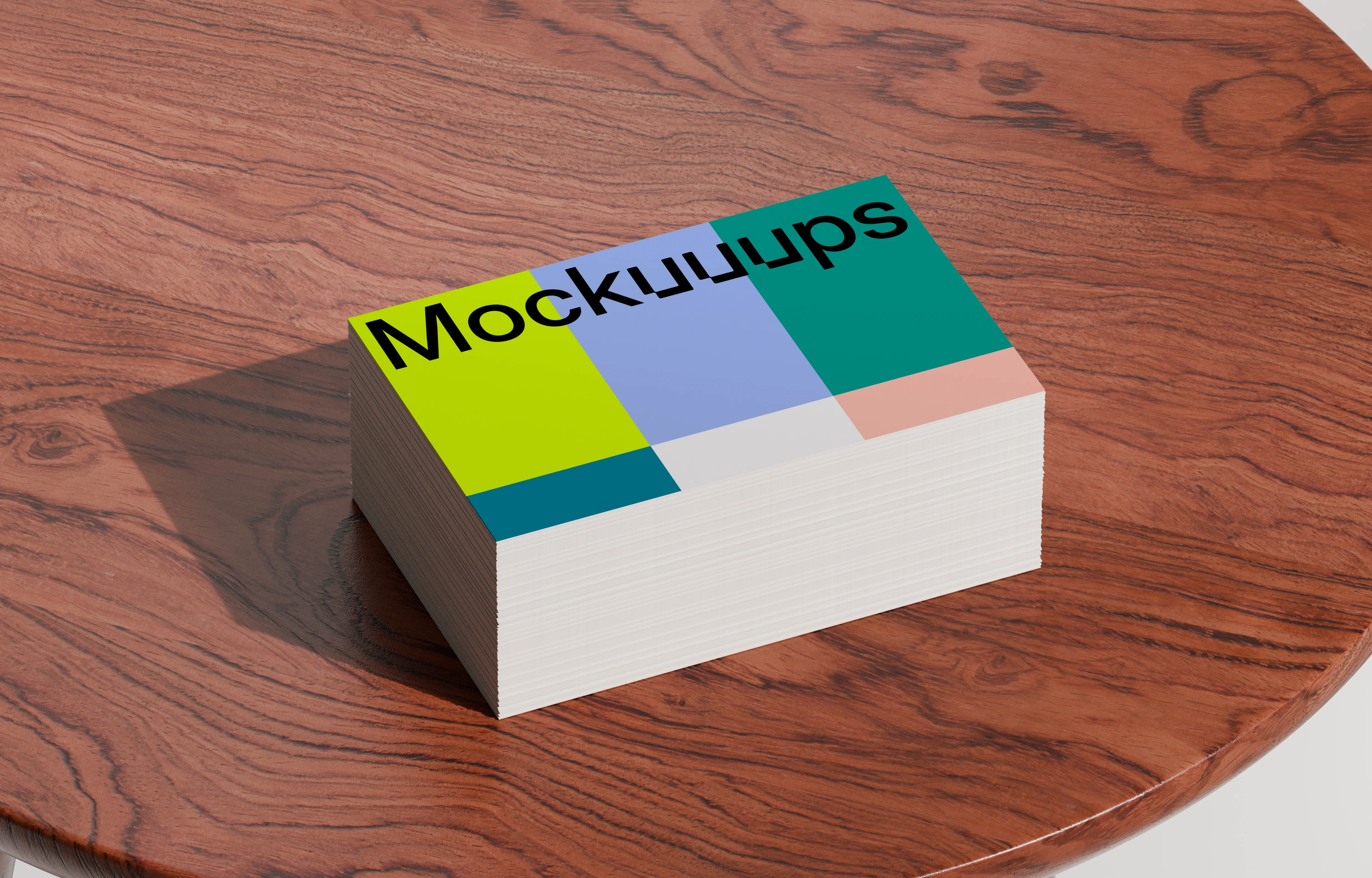 Stack of business card mockups on a wooden table