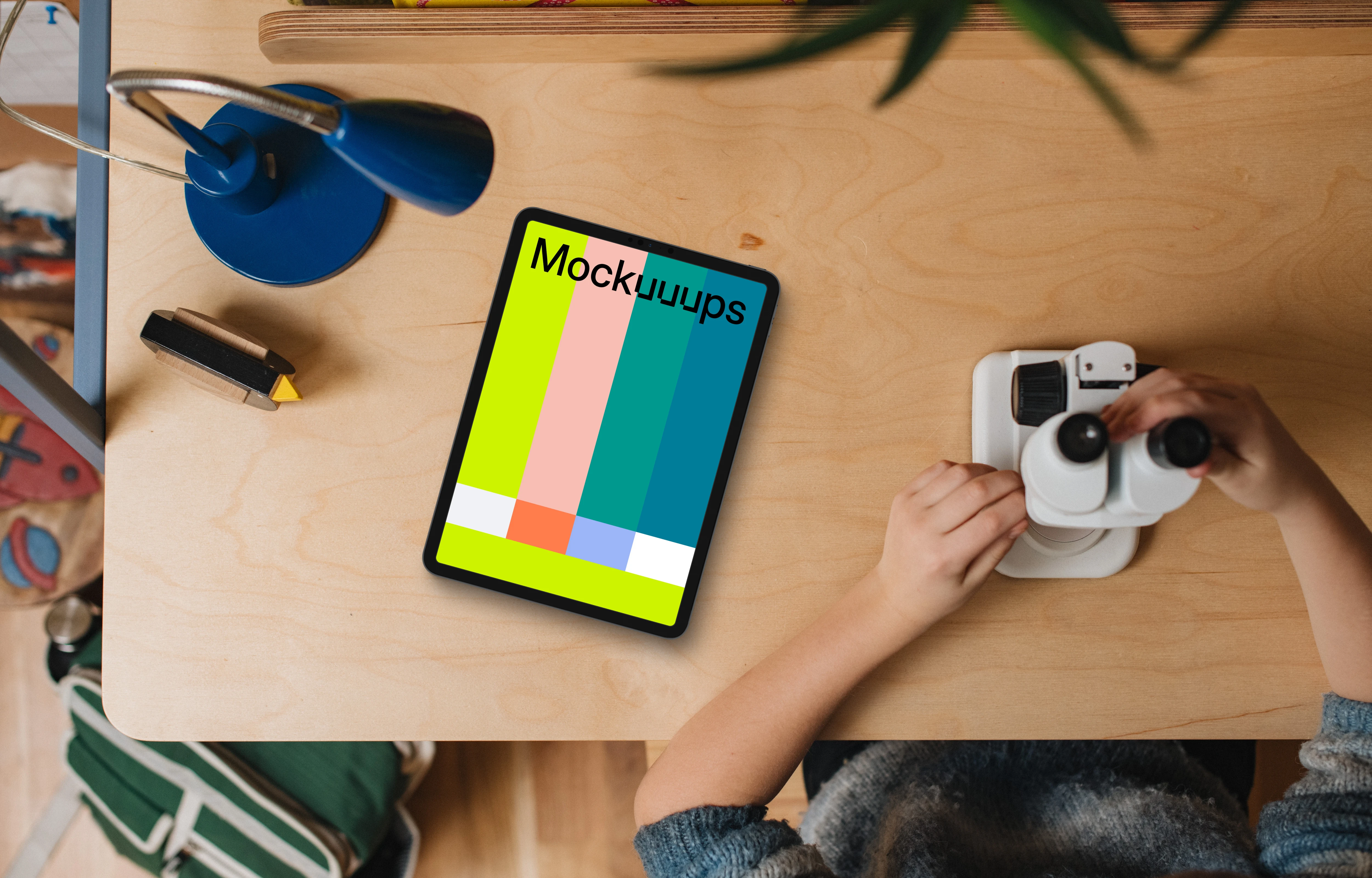 Tablet mockup on child's creative workspace