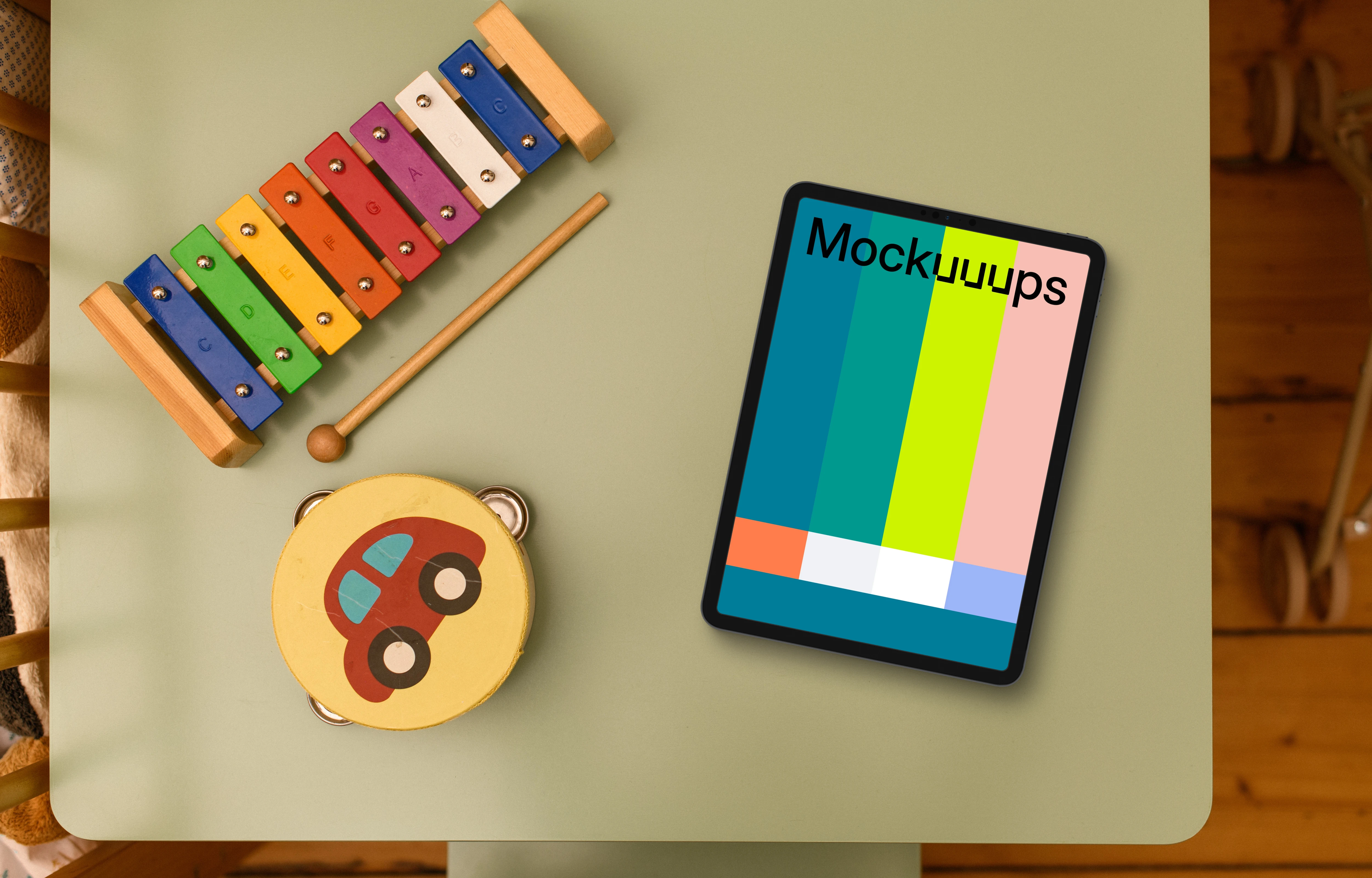 Tablet mockup on kid's study table with educational toys