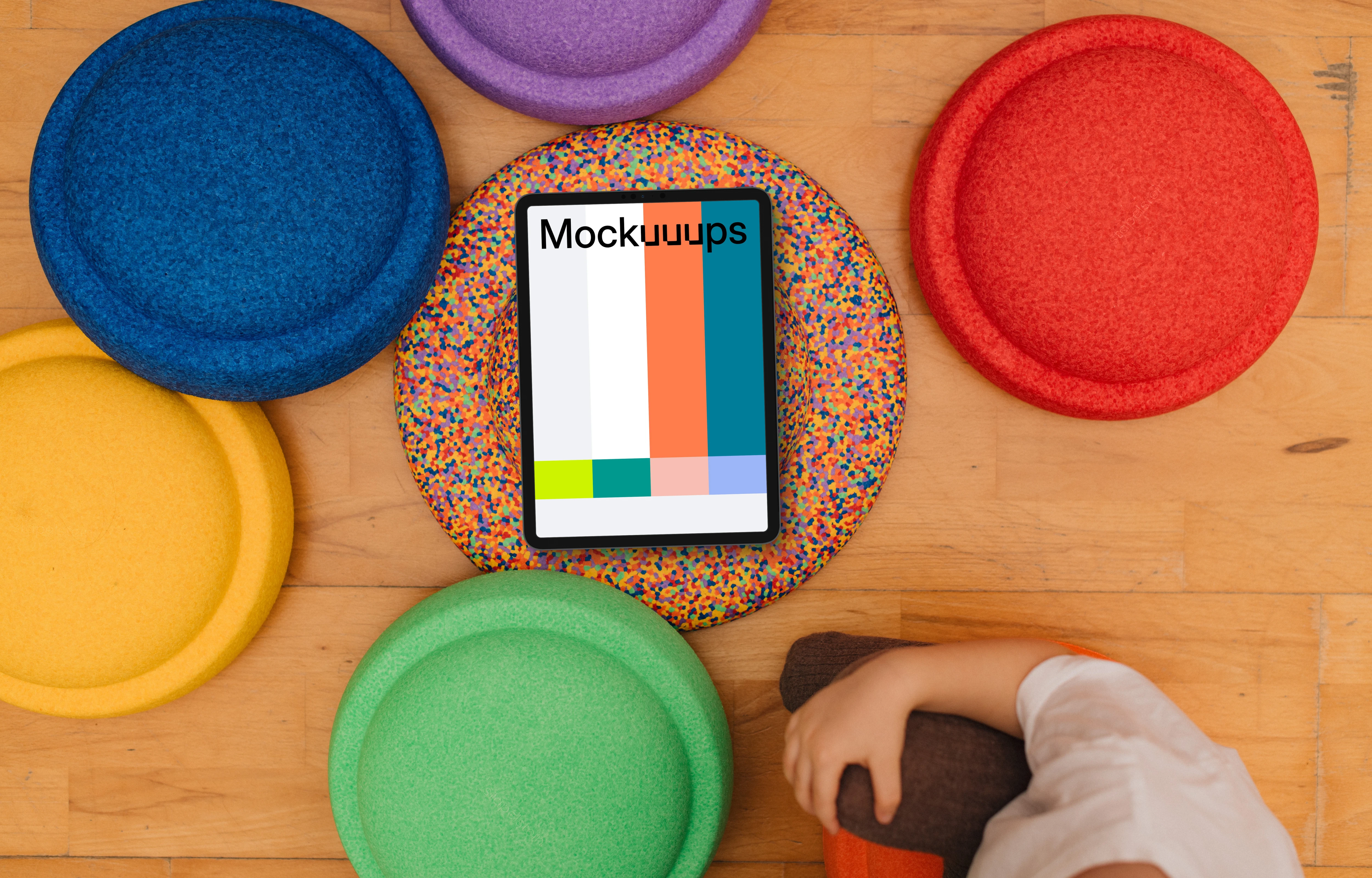 Tablet mockup surrounded by colorful sitting pads