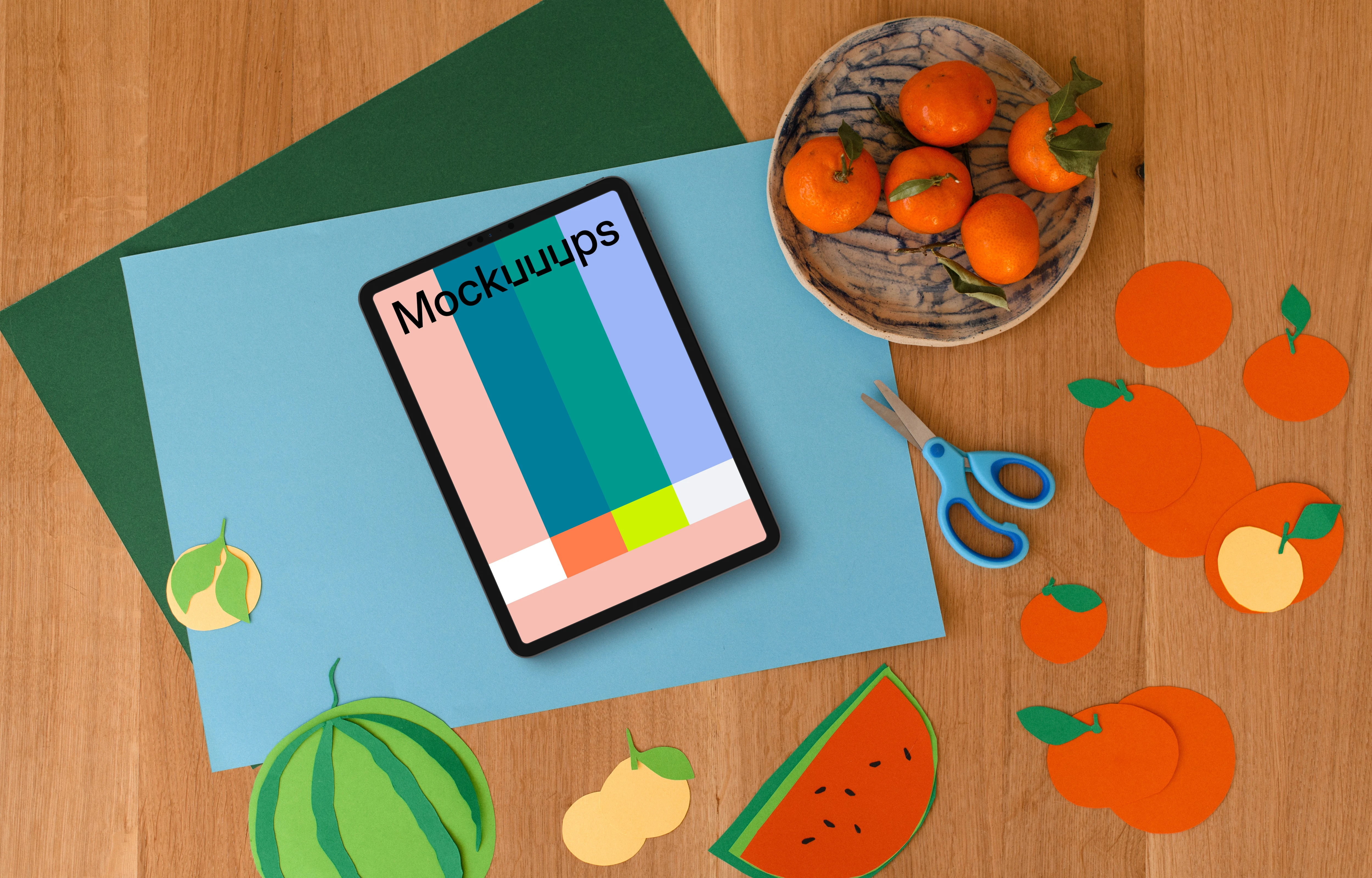 Tablet mockup with colorful fruit paper cutouts for kids
