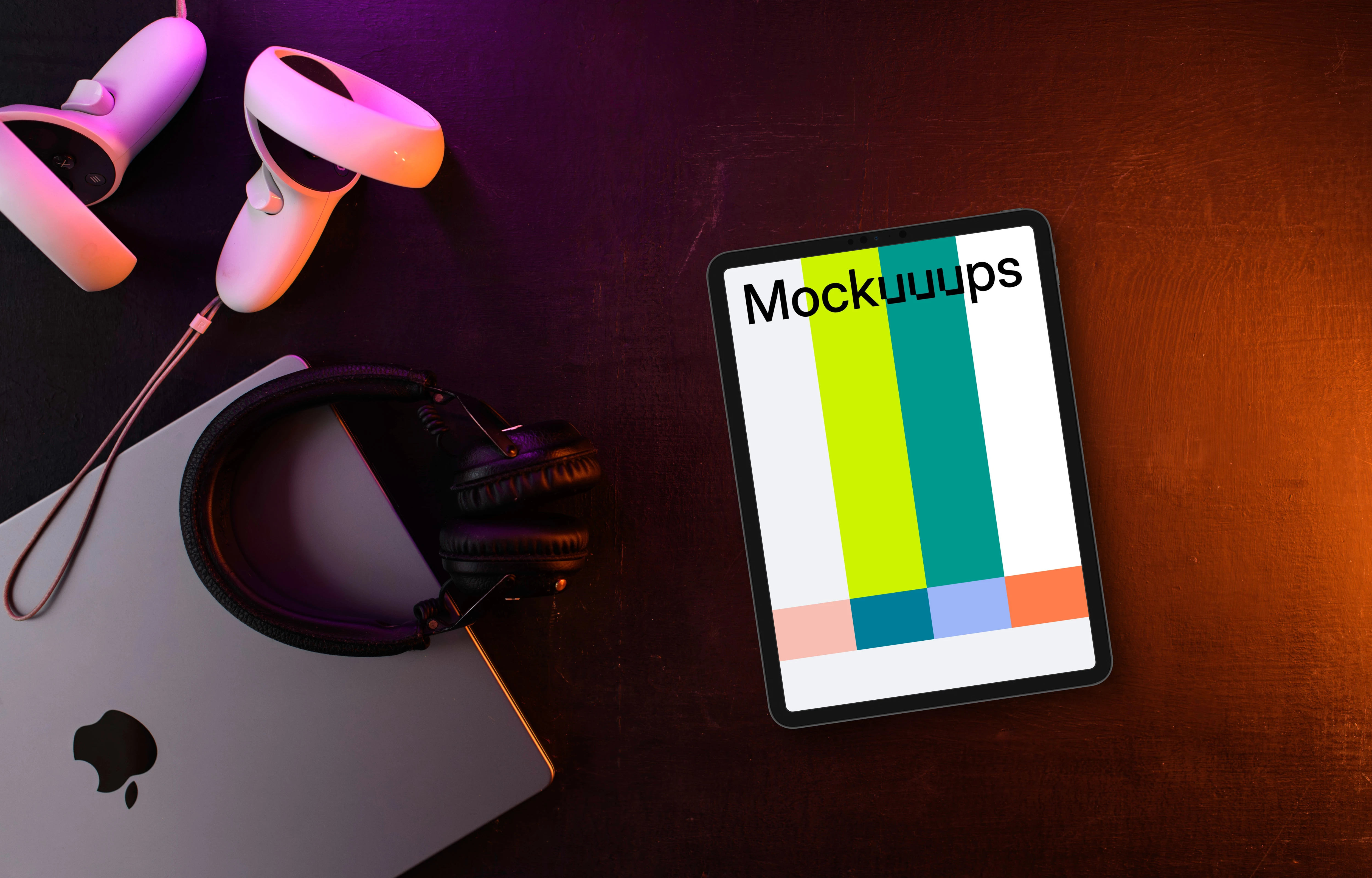 Tablet mockup with gaming gear on a dark wooden surface