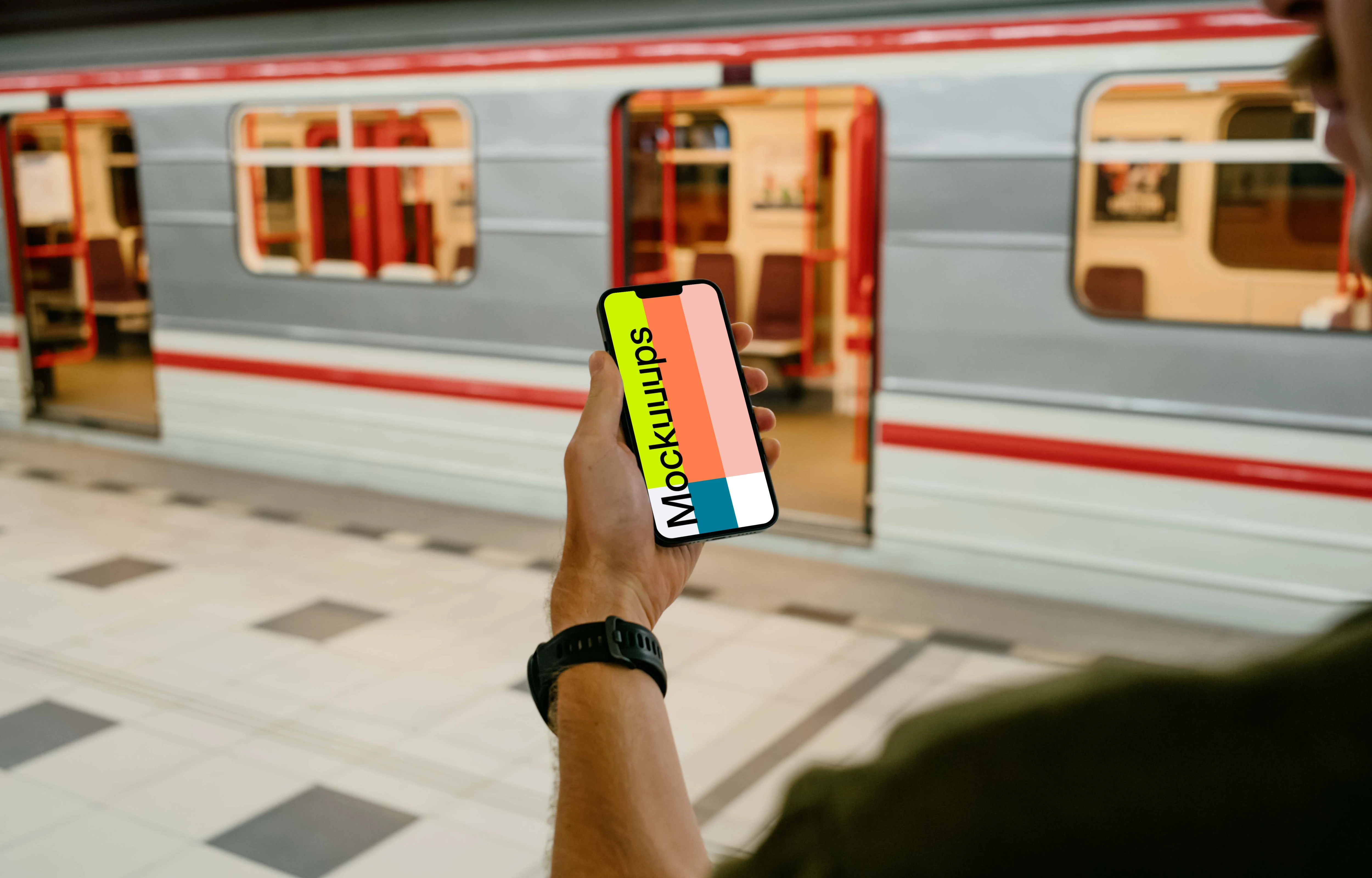 User holding an iPhone 13 mockup