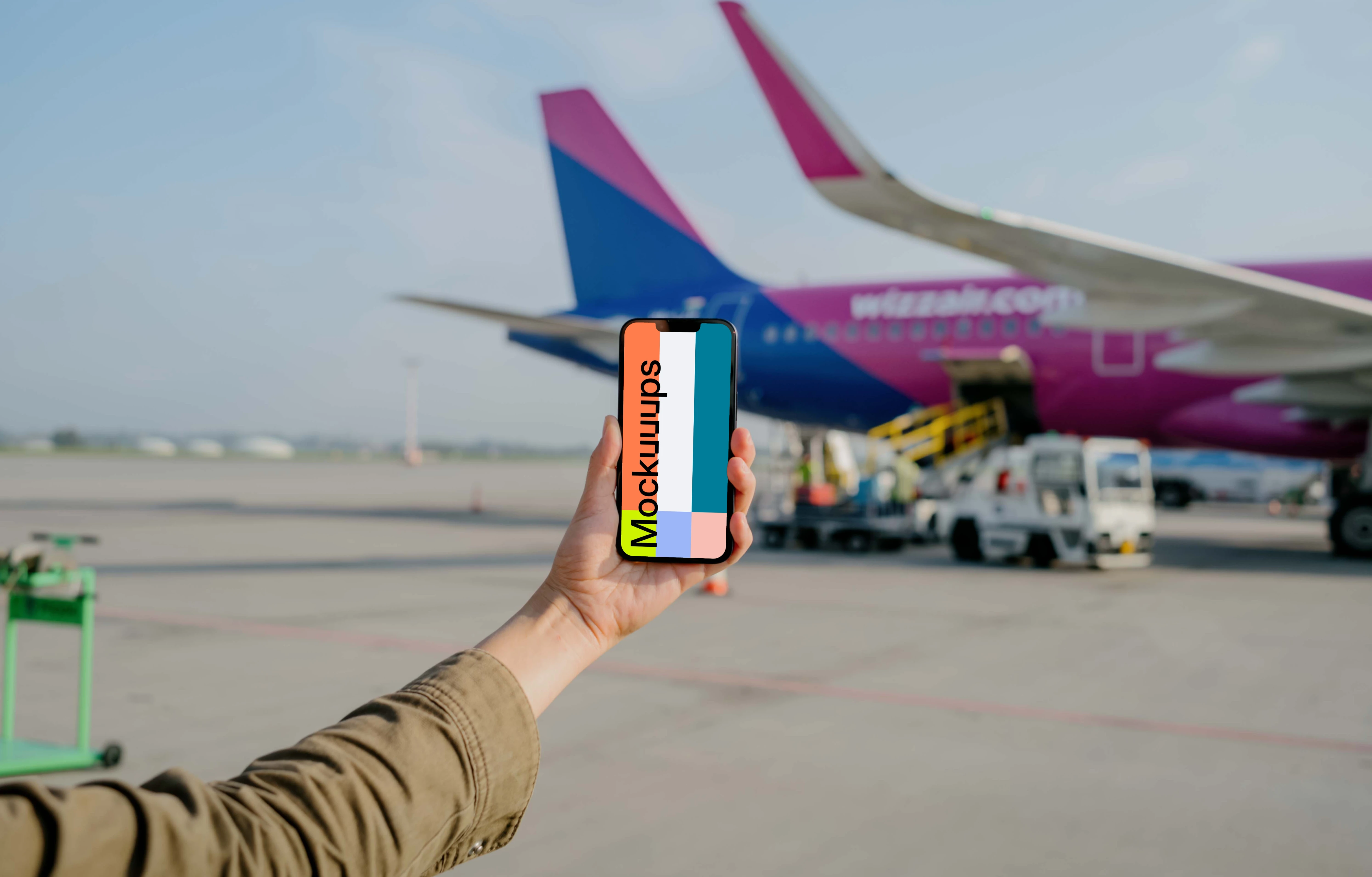 User holding an iPhone mockup