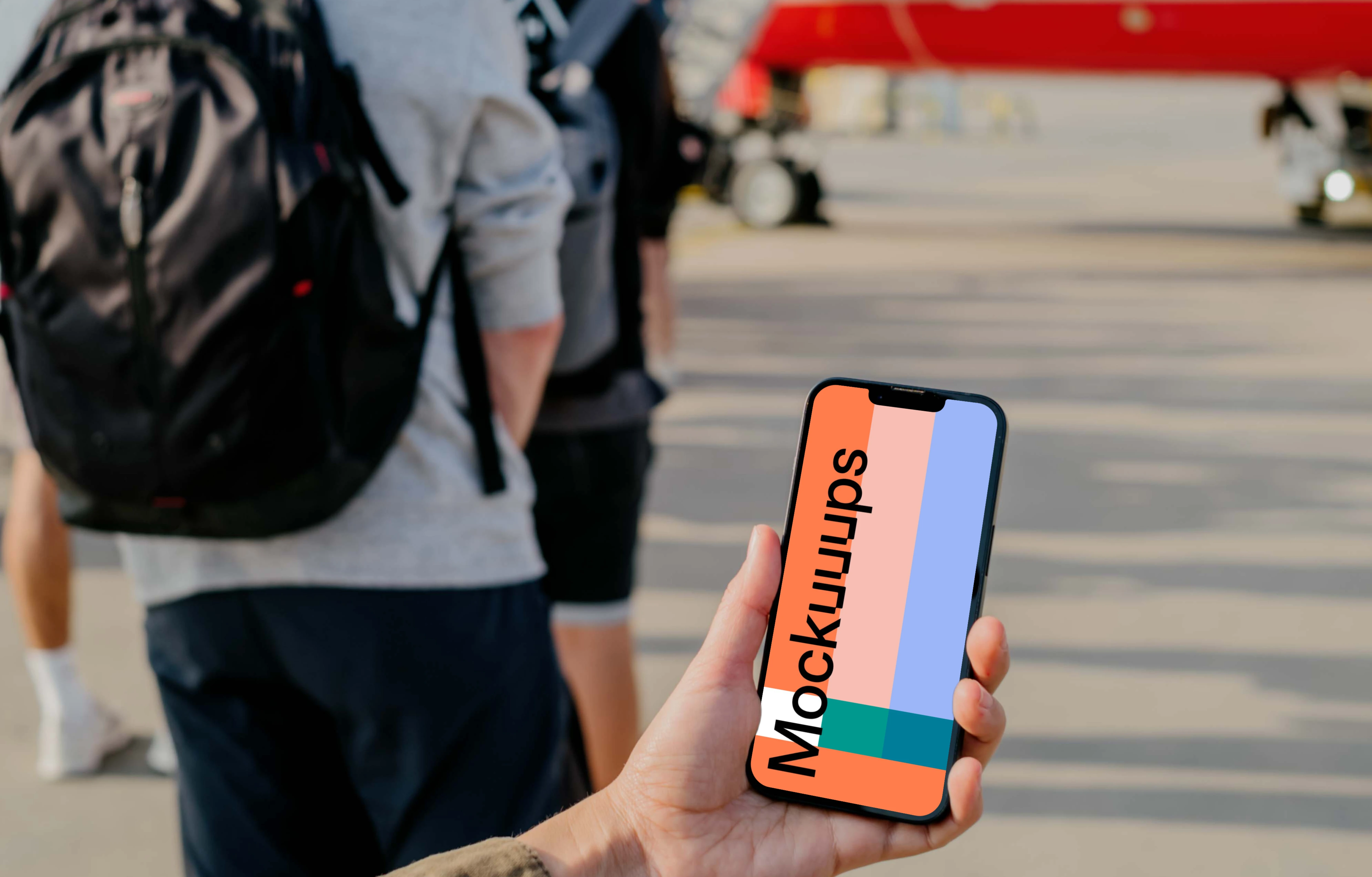 User's hand holding a phone mockup