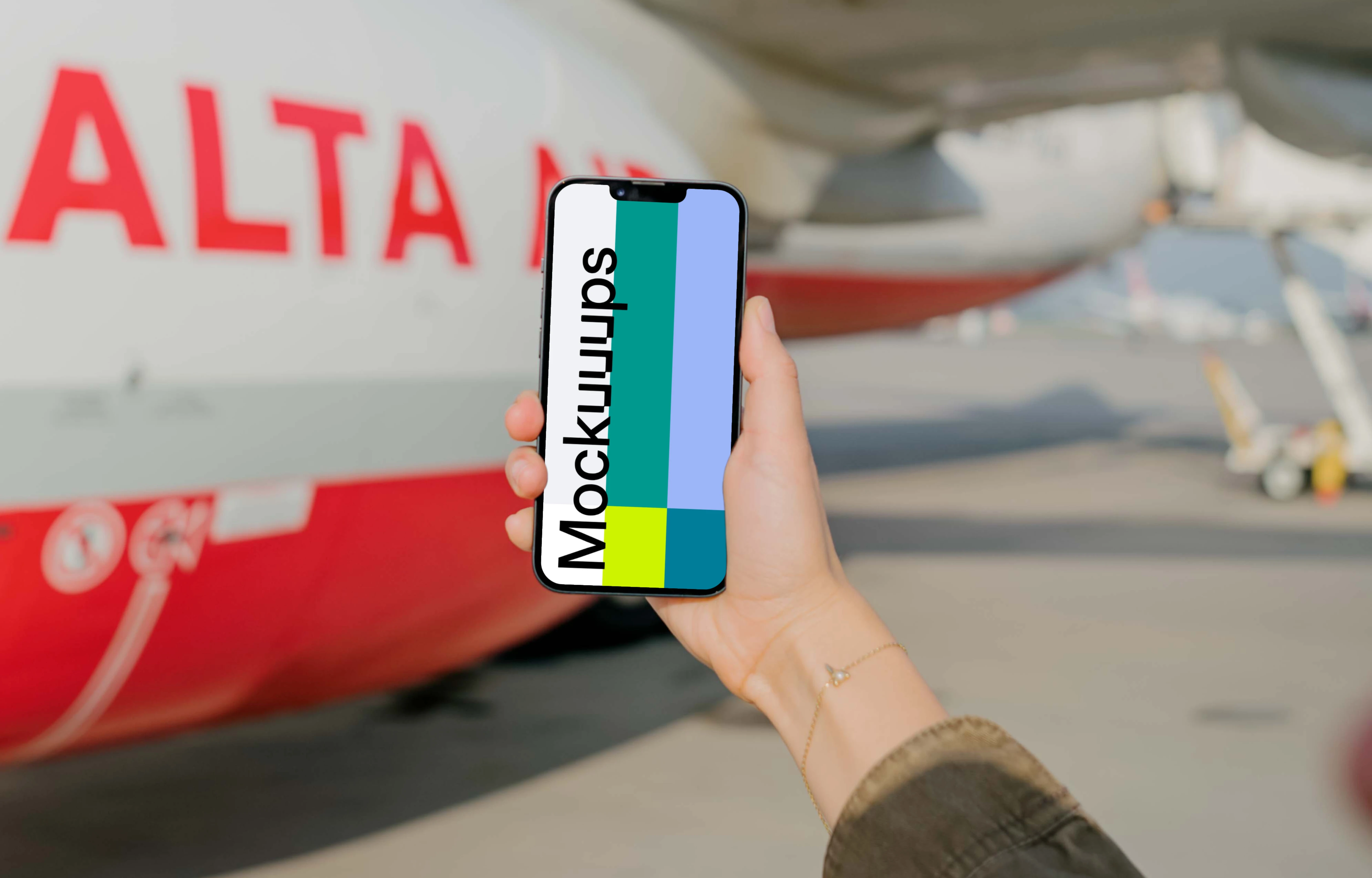 User's hand holding an iPhone mockup