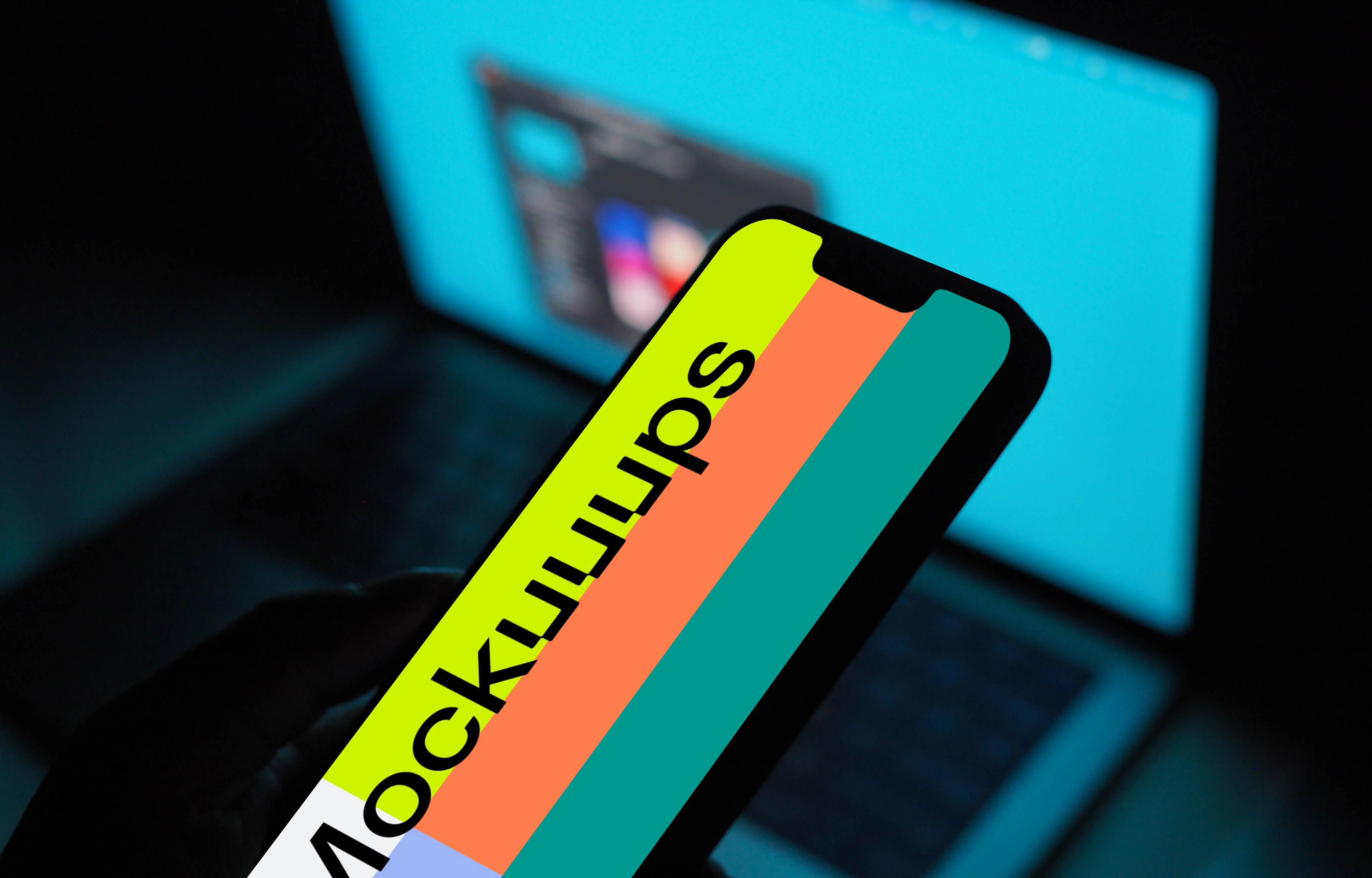 Hand holding an iPhone 13 mockup