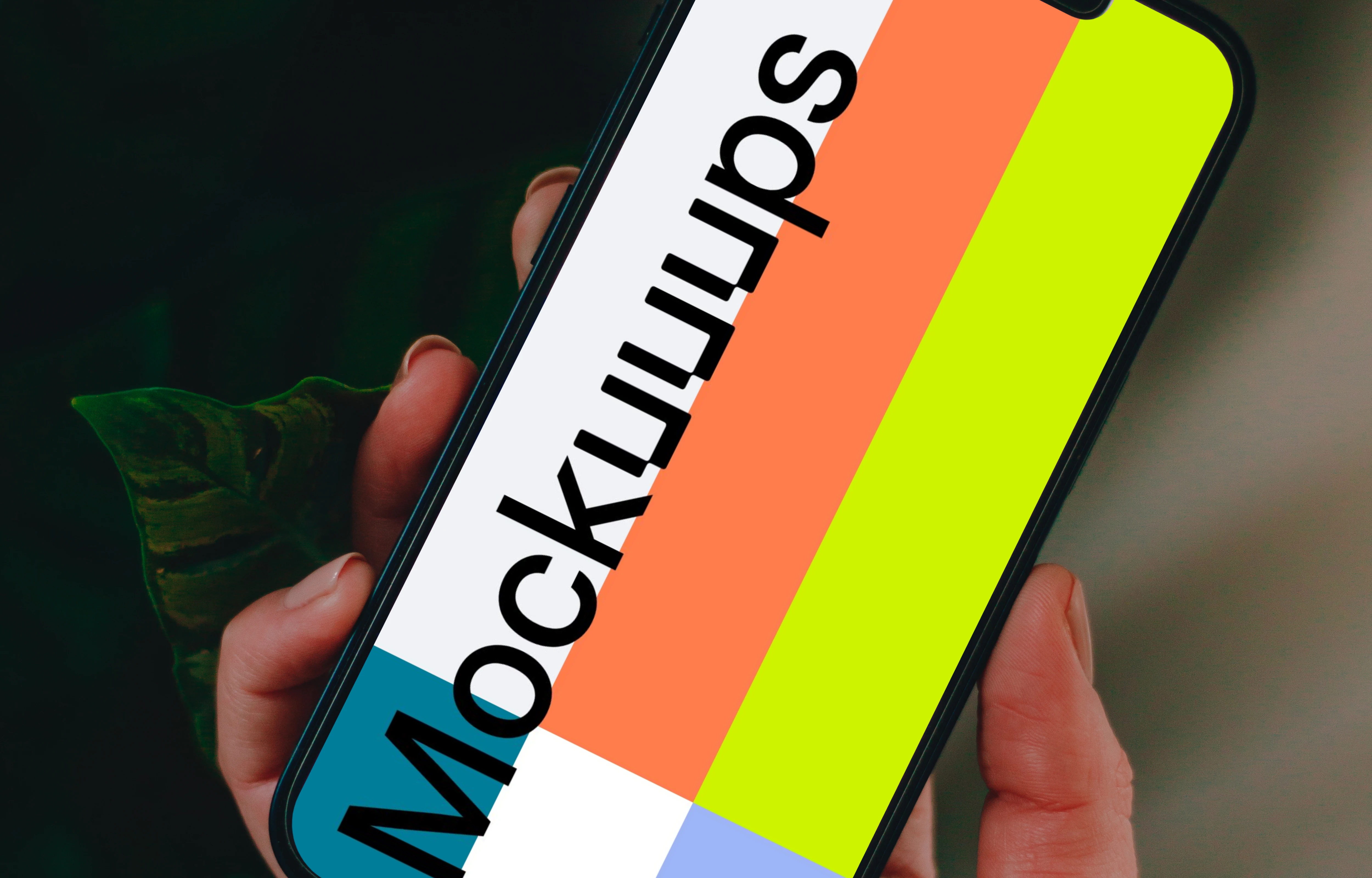 Person holding up an iPhone 13 mockup