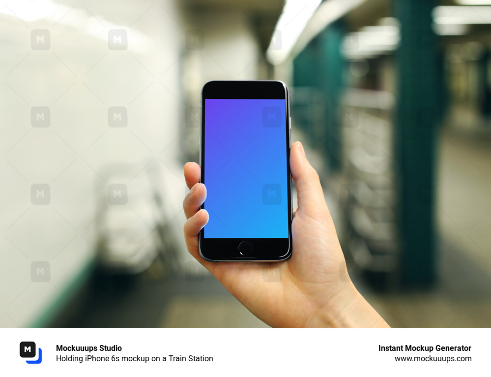 Holding iPhone 6s mockup on a Train Station