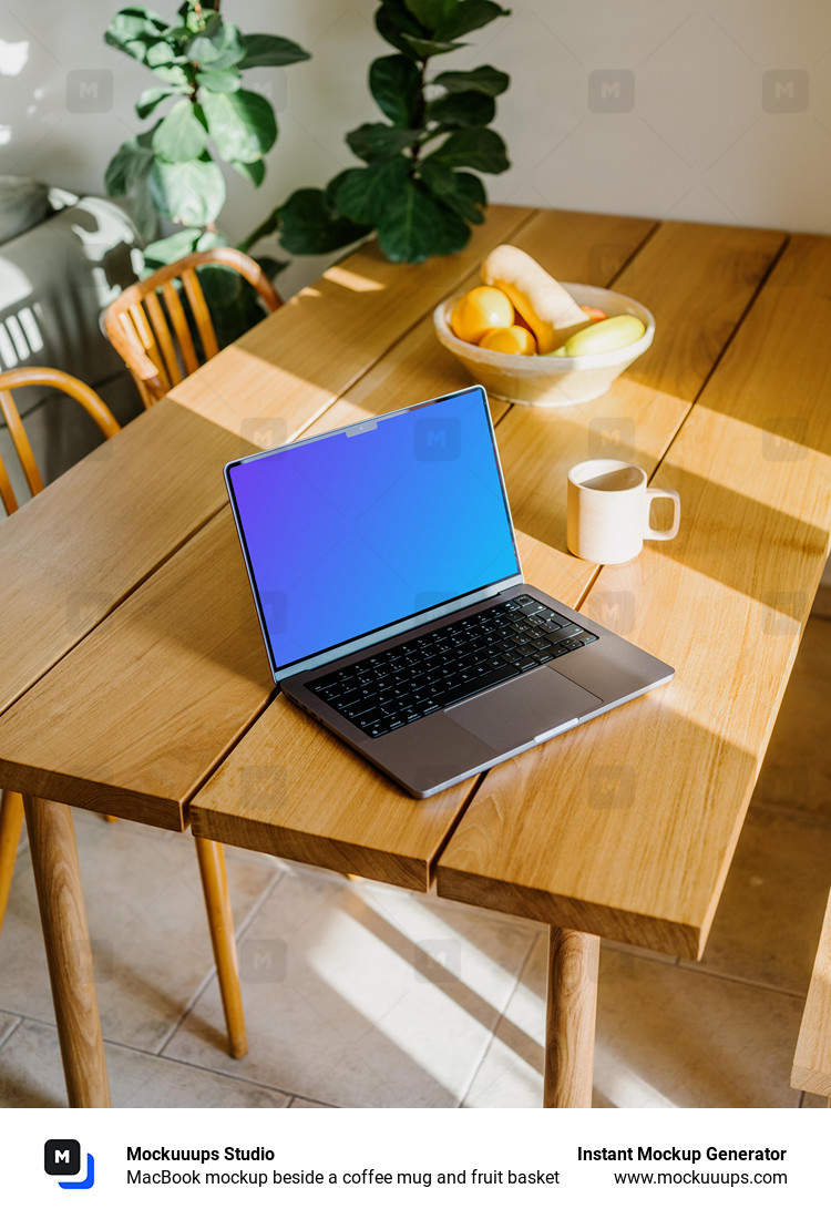 MacBook mockup beside a coffee mug and fruit basket