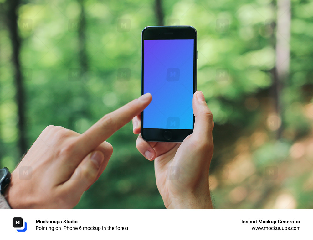 Pointing on iPhone 6 mockup in the forest
