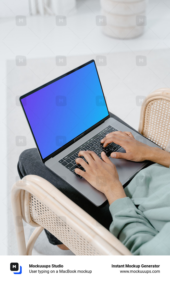 User typing on a MacBook mockup