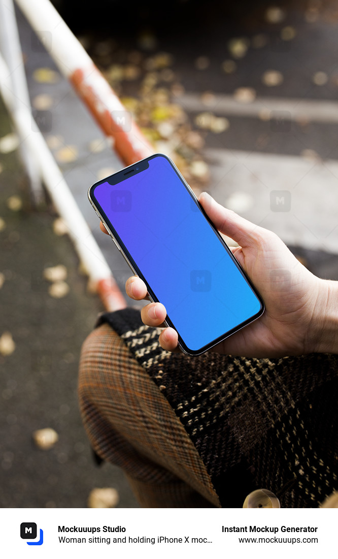 Woman sitting and holding iPhone X mockup
