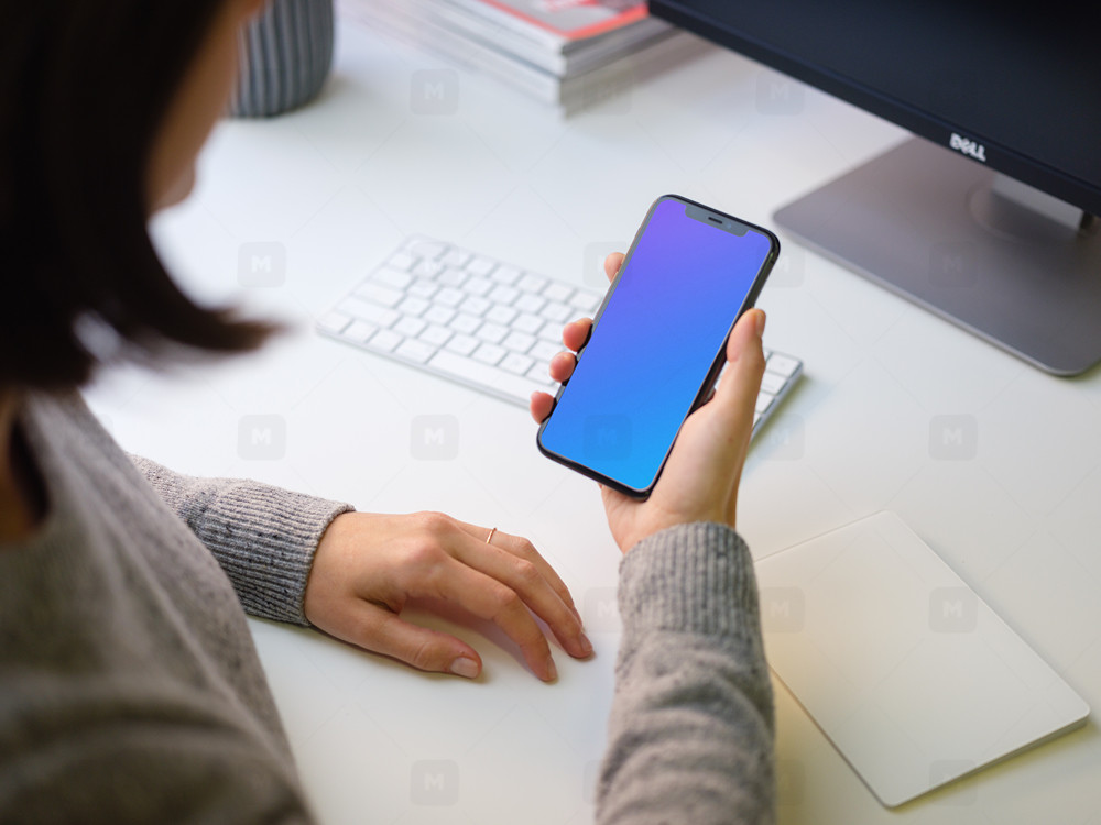 Young Woman holding iPhone 11 mockup