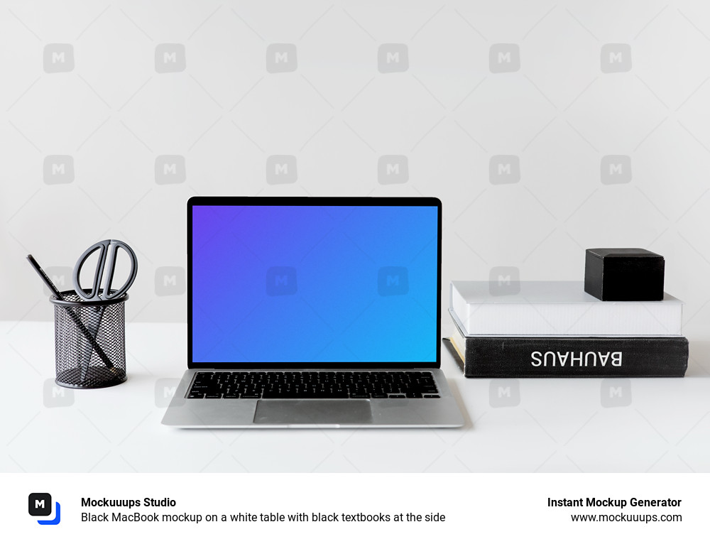 Black MacBook mockup on a white table with black textbooks at the side