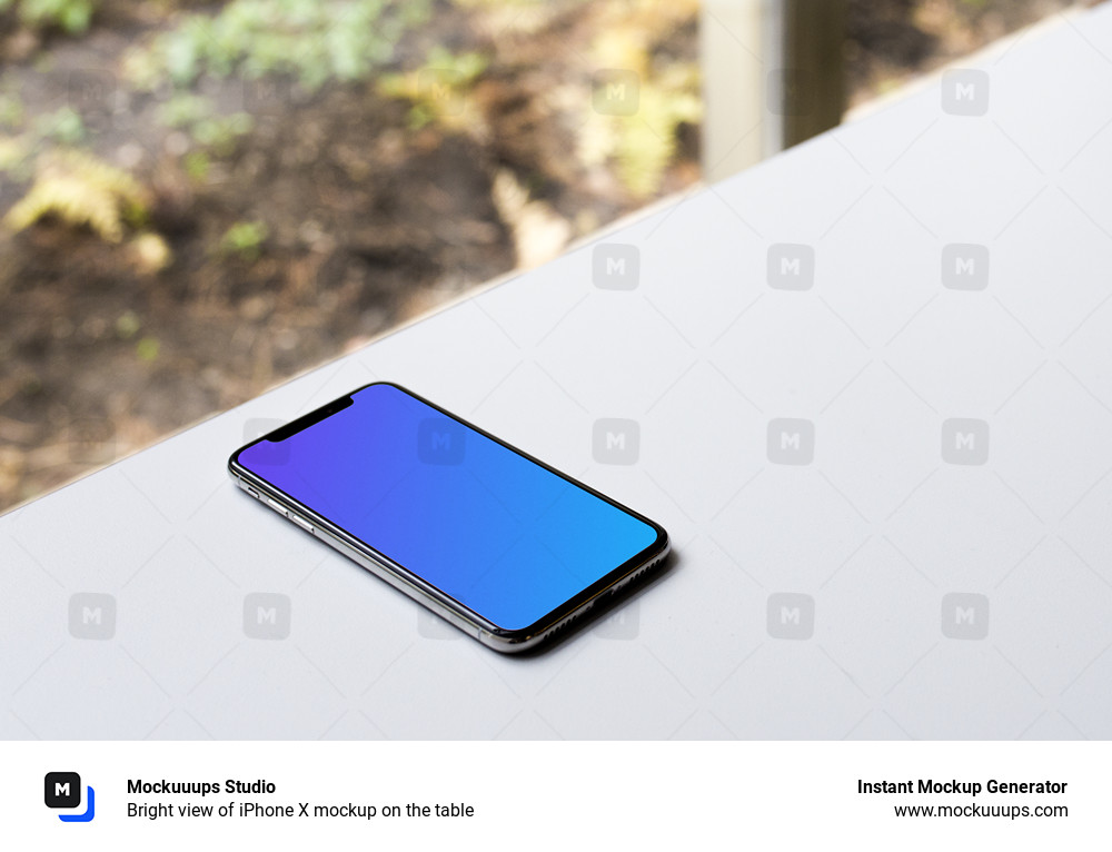 Bright view of iPhone X mockup on the table