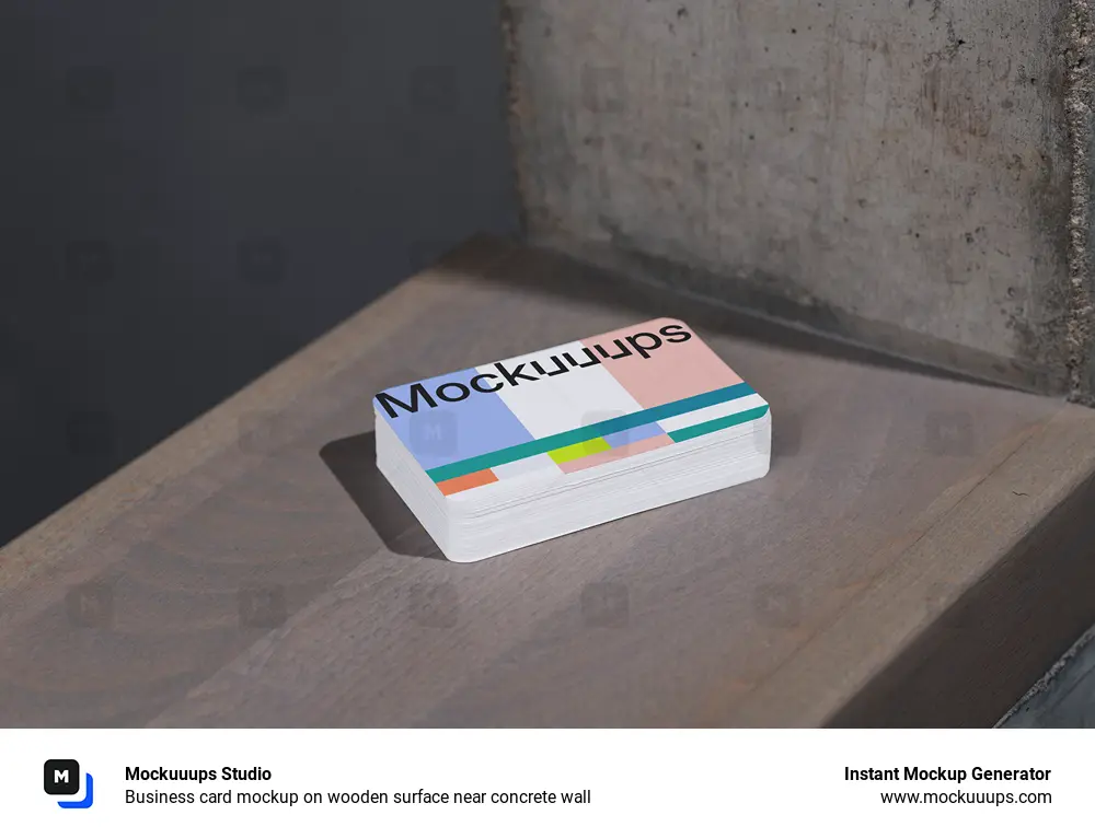 Business card mockup on wooden surface near concrete wall