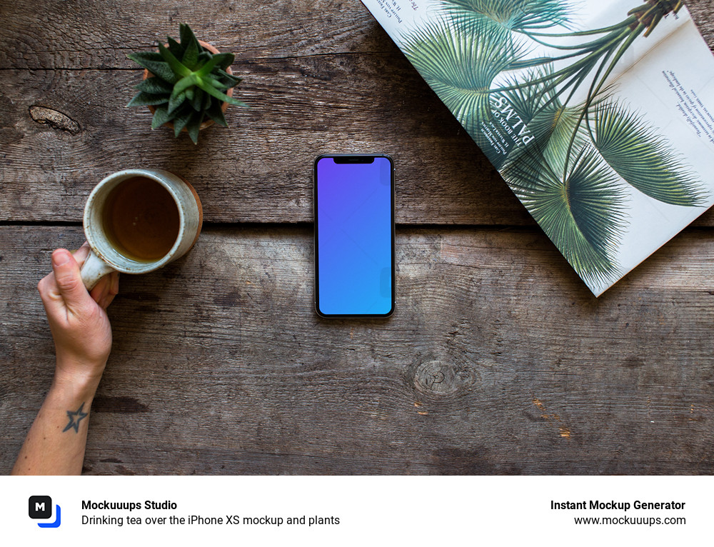 Drinking tea over the iPhone XS mockup and plants