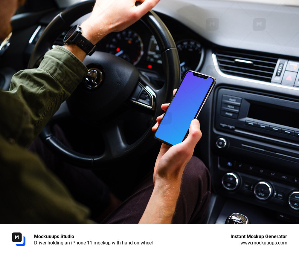 Driver holding an iPhone 11 mockup with hand on wheel